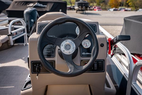 2025 Sun Tracker BASS BUGGY 18 steering console with gauges and controls.