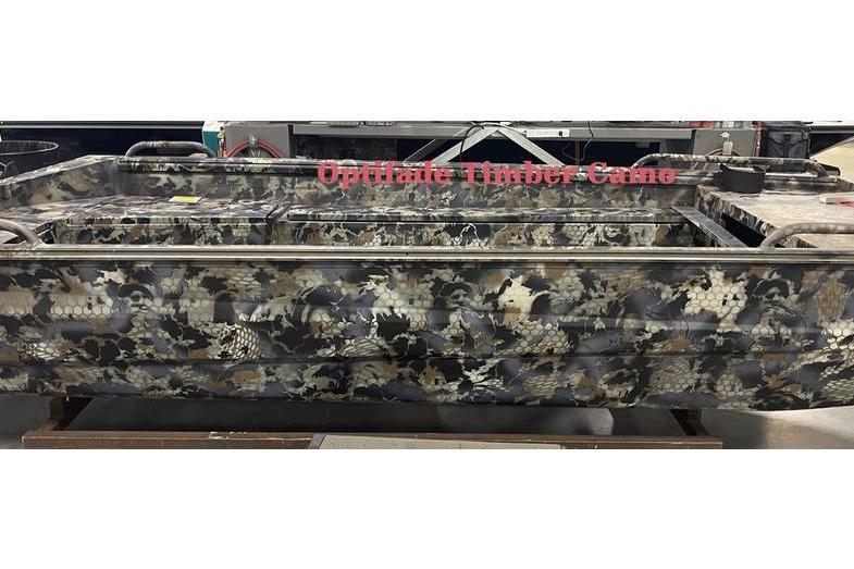 Camouflage-patterned 2026 Excel Switchblade boat with Optifade Timber Camo design.