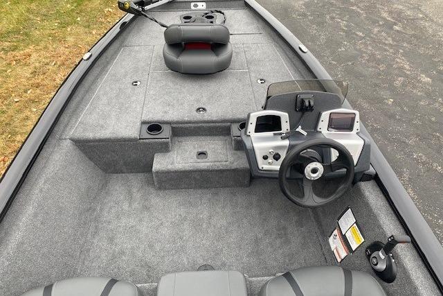 2026 Tracker Pro Team 175 boat interior with steering console and seating.