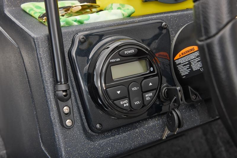 2026 Tracker Targa V-18 Combo dashboard with audio controls and ignition keys.
