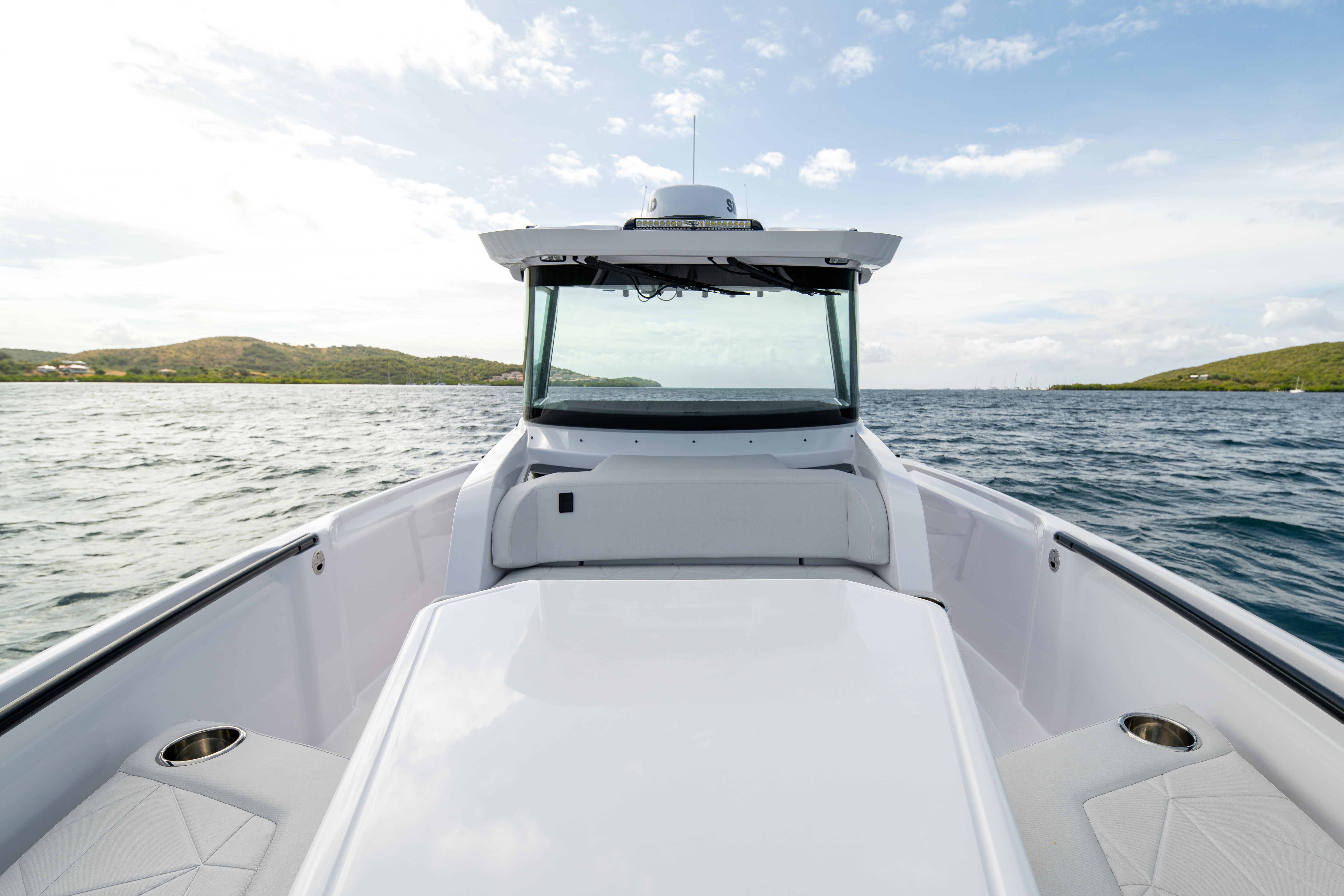 2025 Axopar 29 CCX boat on open water, showcasing sleek design and spacious deck.