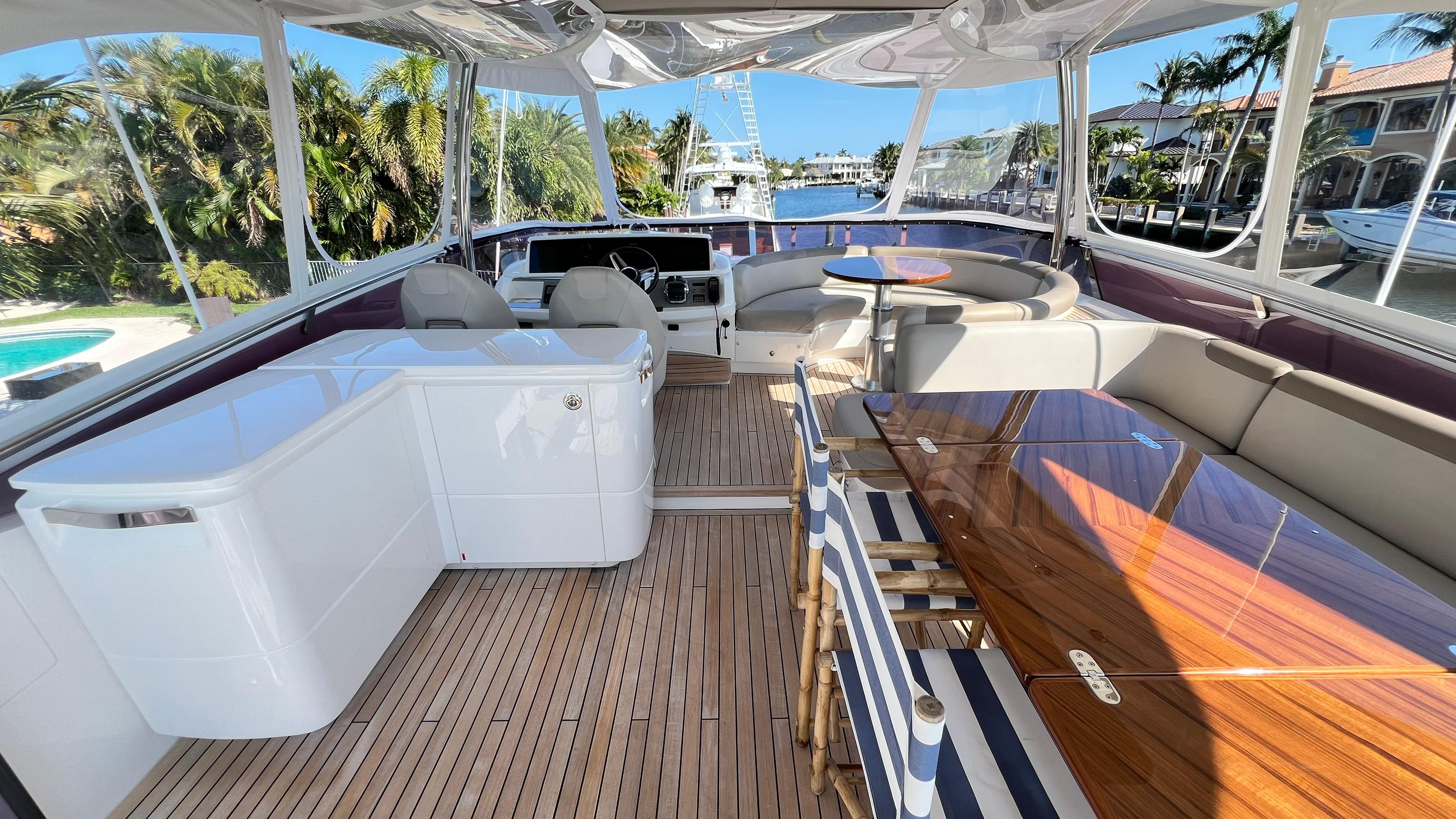 Luxurious 2019 Princess F62 yacht interior with elegant seating and wooden flooring.
