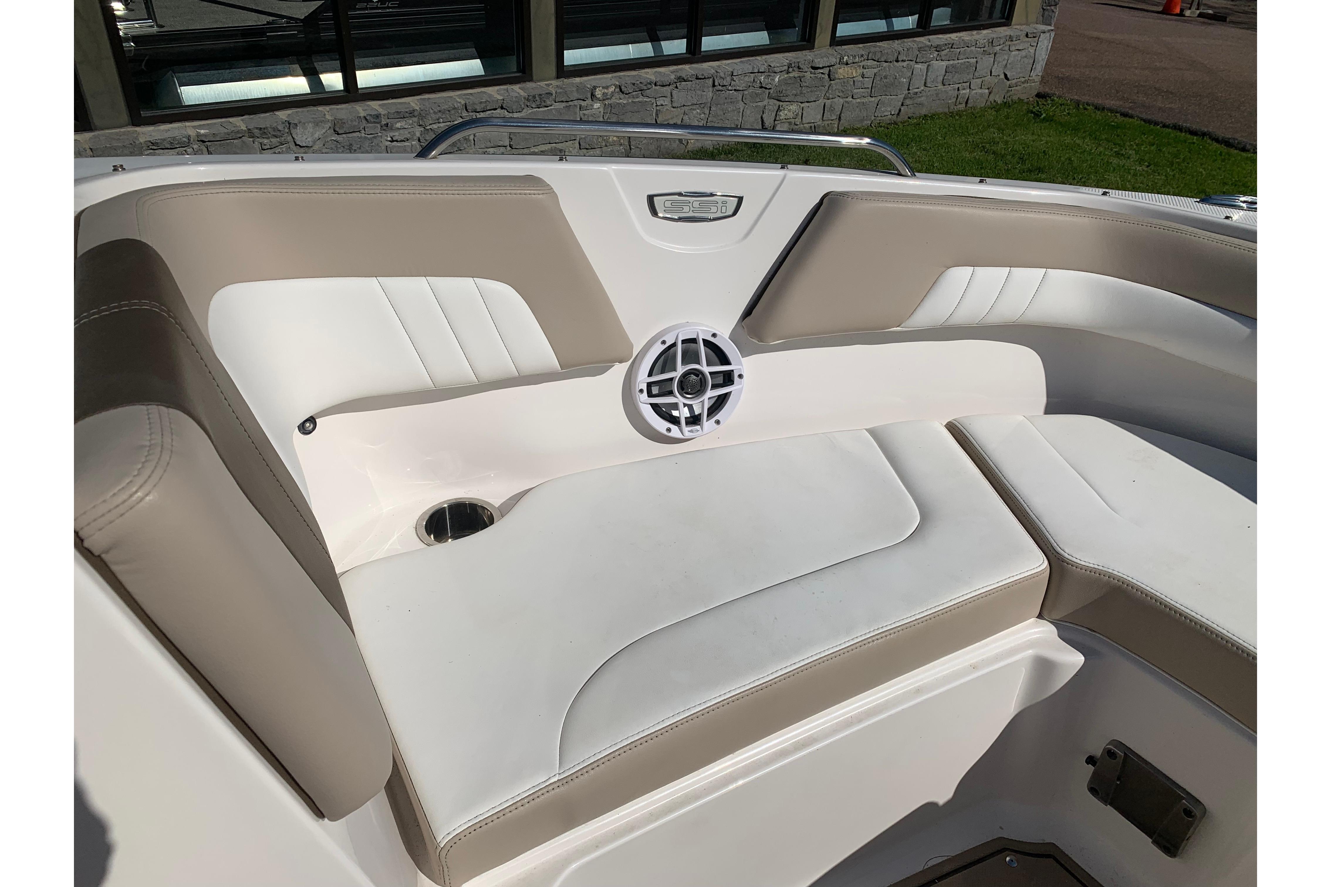 2022 Chaparral 23 SSi boat interior with beige and white seating.