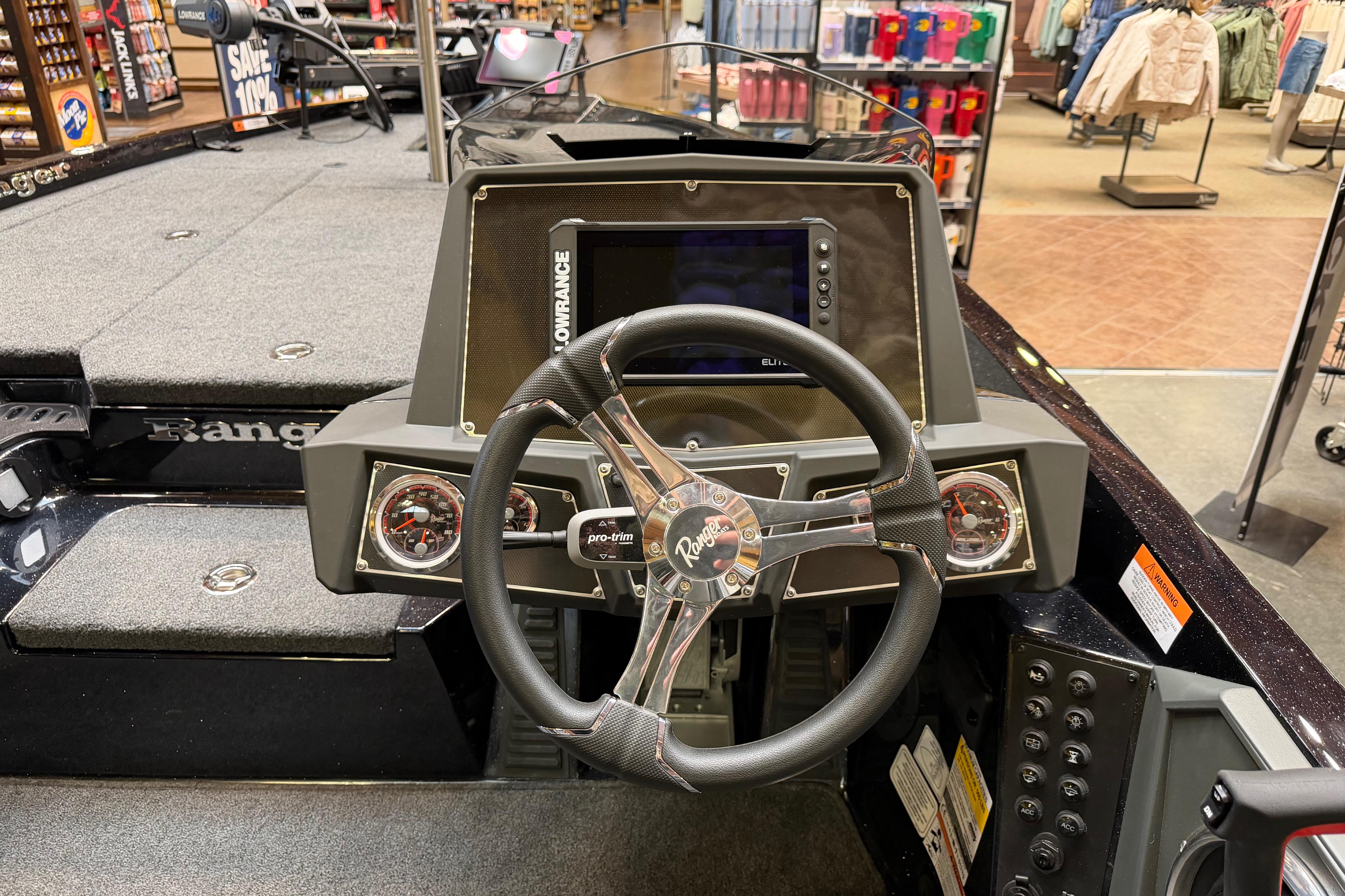 2026 Ranger Z518 boat dashboard with steering wheel and electronic display.