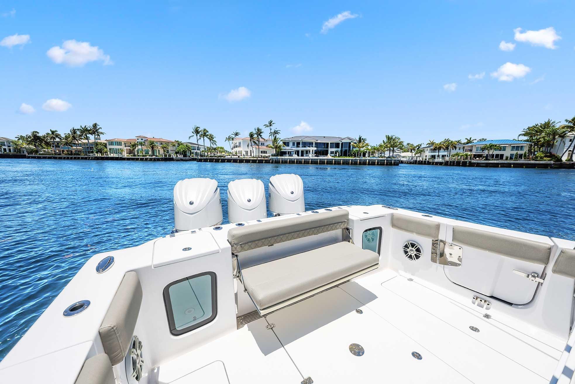 2024 Sportsman Open 352 Center Console boat on a sunny waterfront.