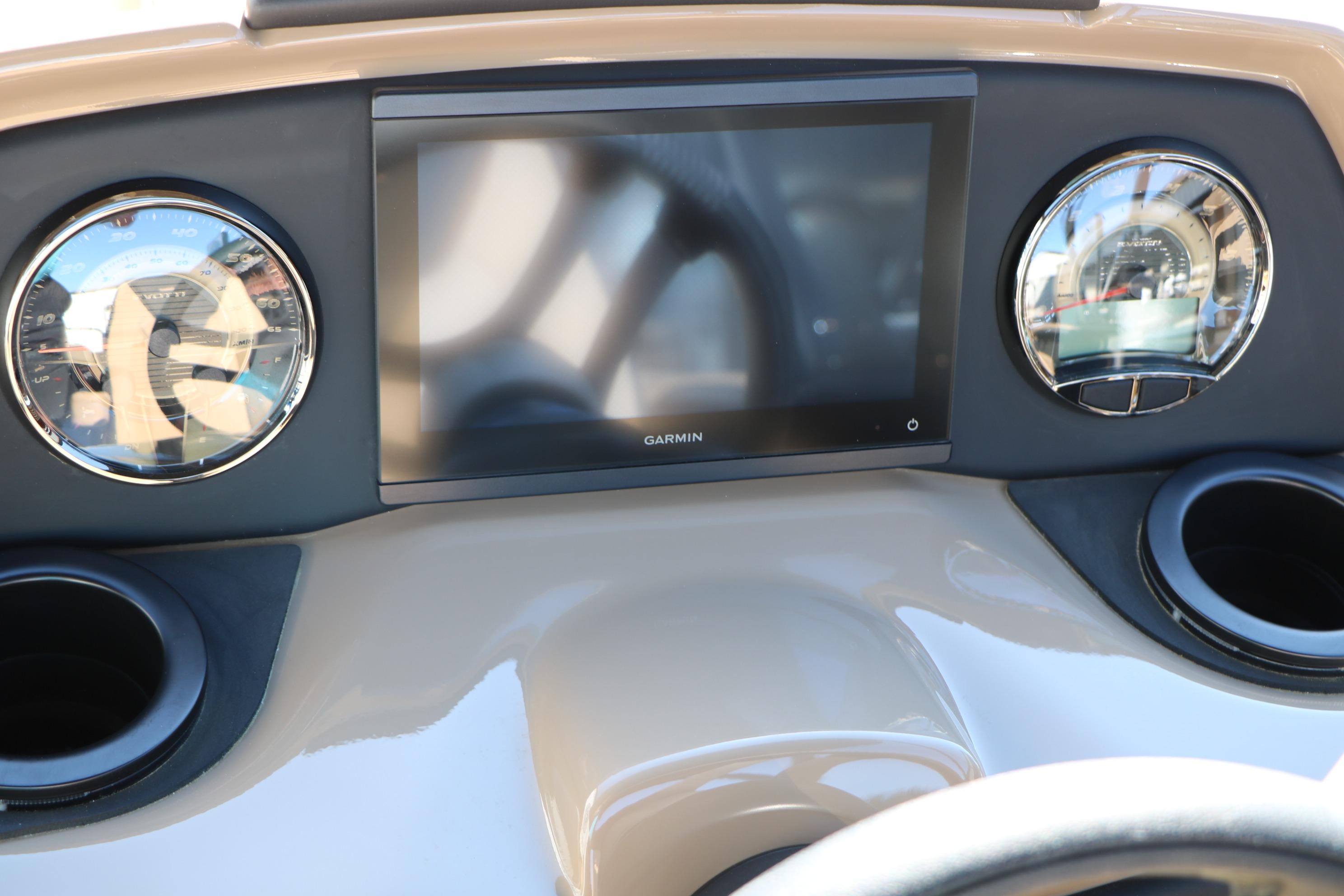 Dashboard of 2026 Evotti 525 QL Tri-Toon with Garmin display and gauges.