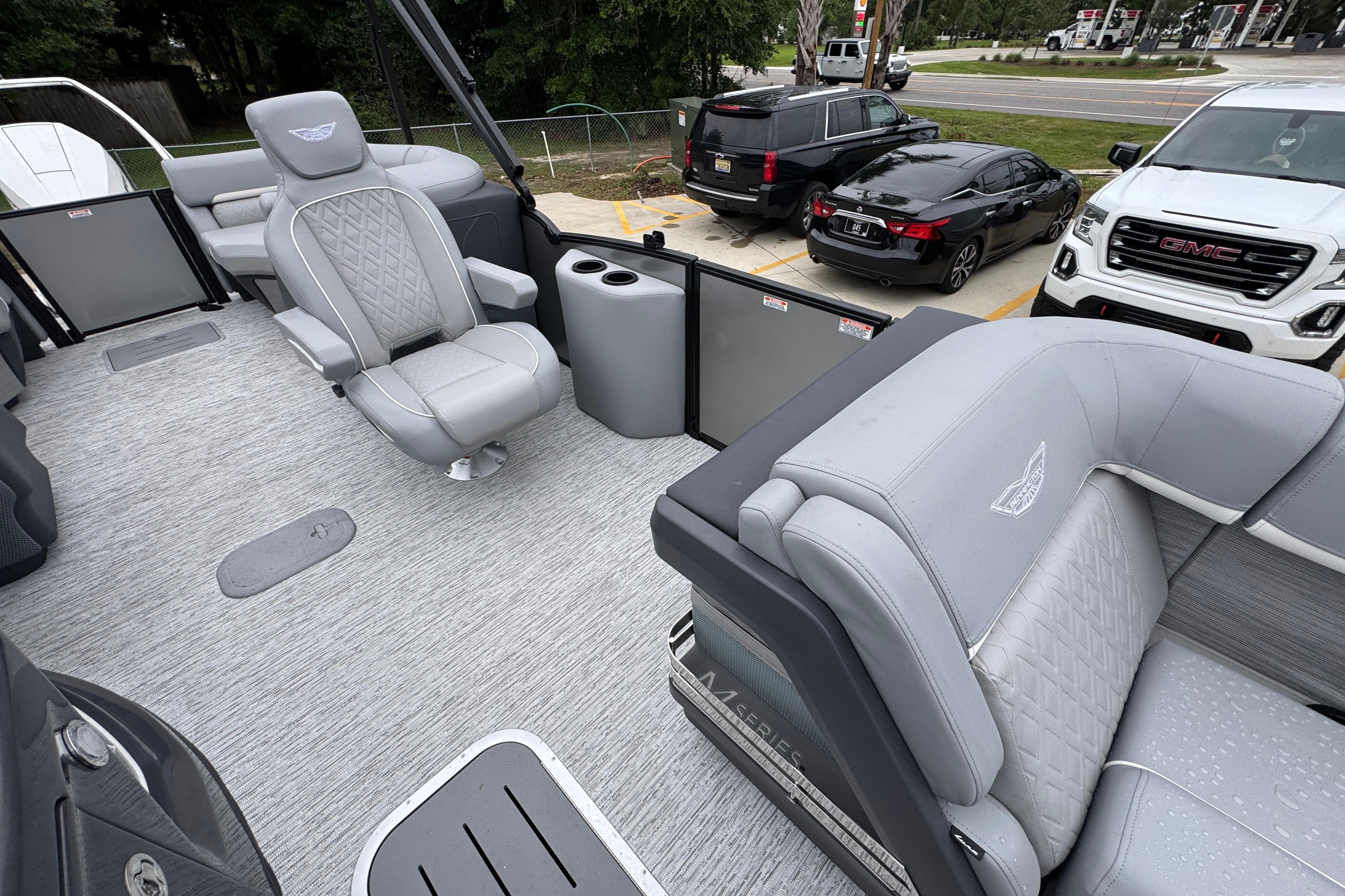 2027 Bennington 24 MFB pontoon boat interior with luxurious gray seating and modern design.