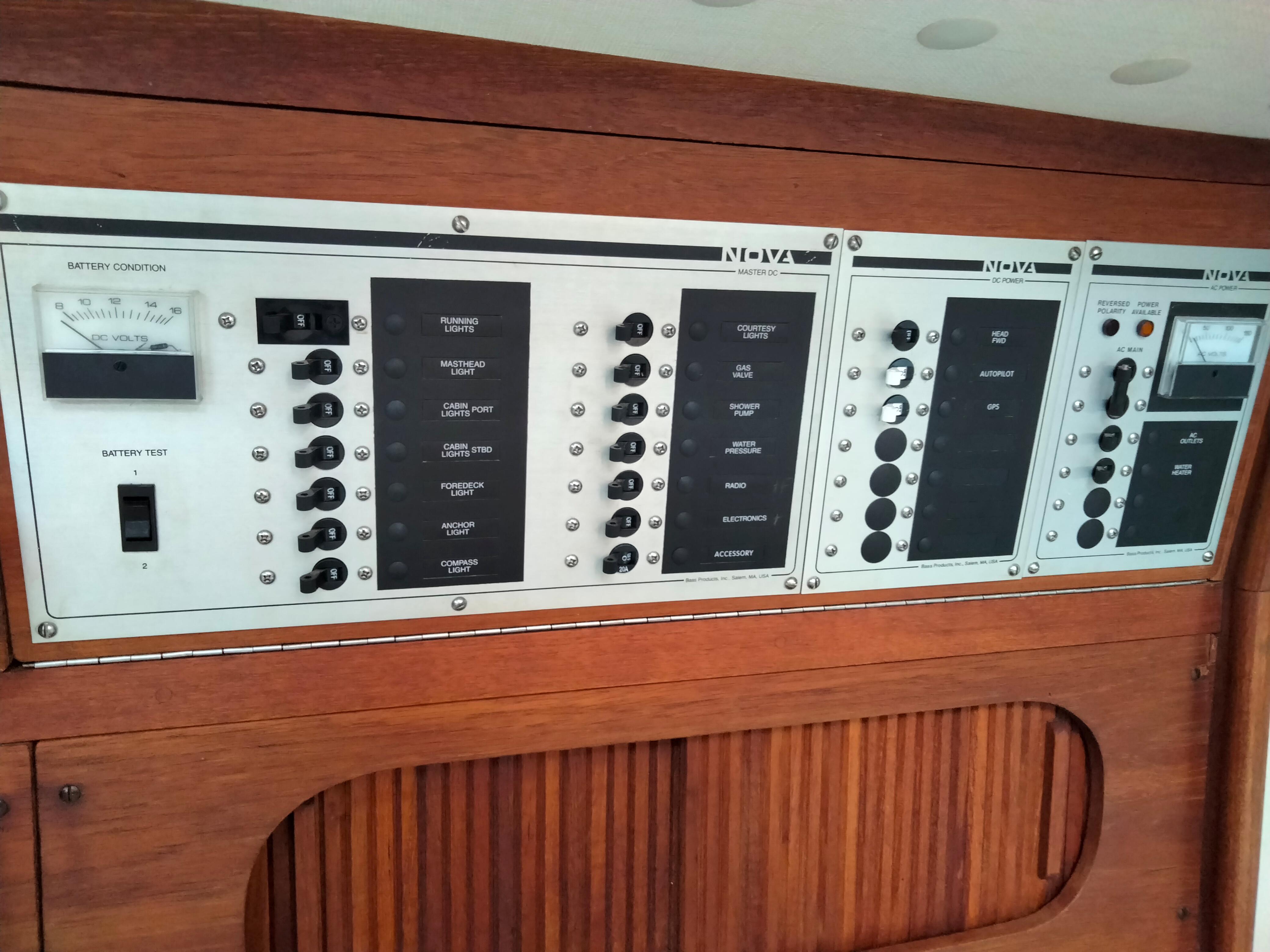 Electrical control panel on a 1989 Sabre 34 MK II sailboat, featuring switches and gauges.