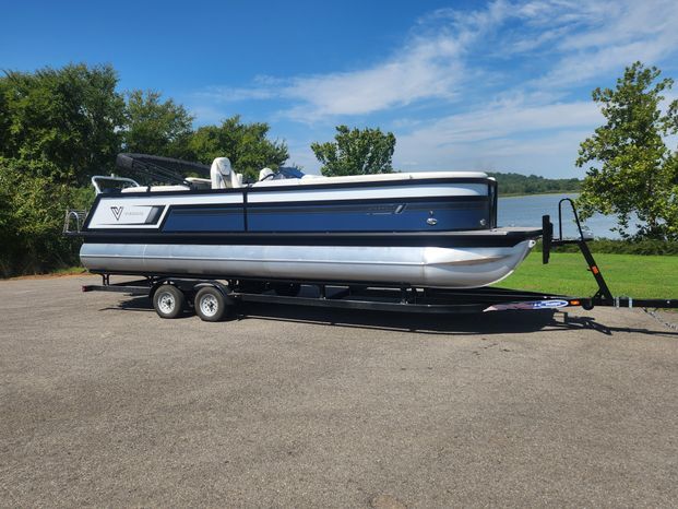Viaggio Diamante 26U Platinum 2023 pontoon boat on trailer by lakeside.