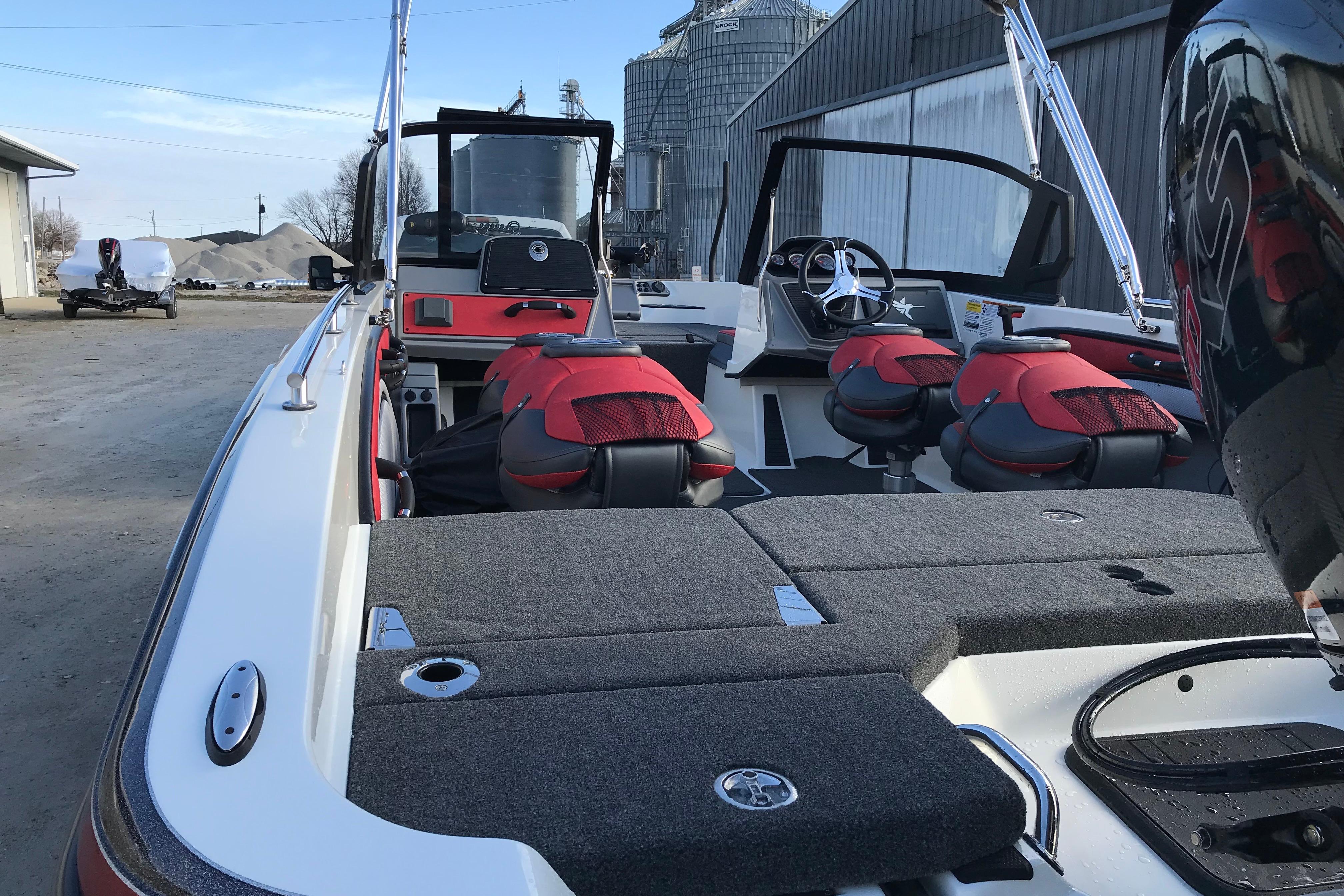 2026 Ranger 1850MS boat interior with red seats and modern dashboard.