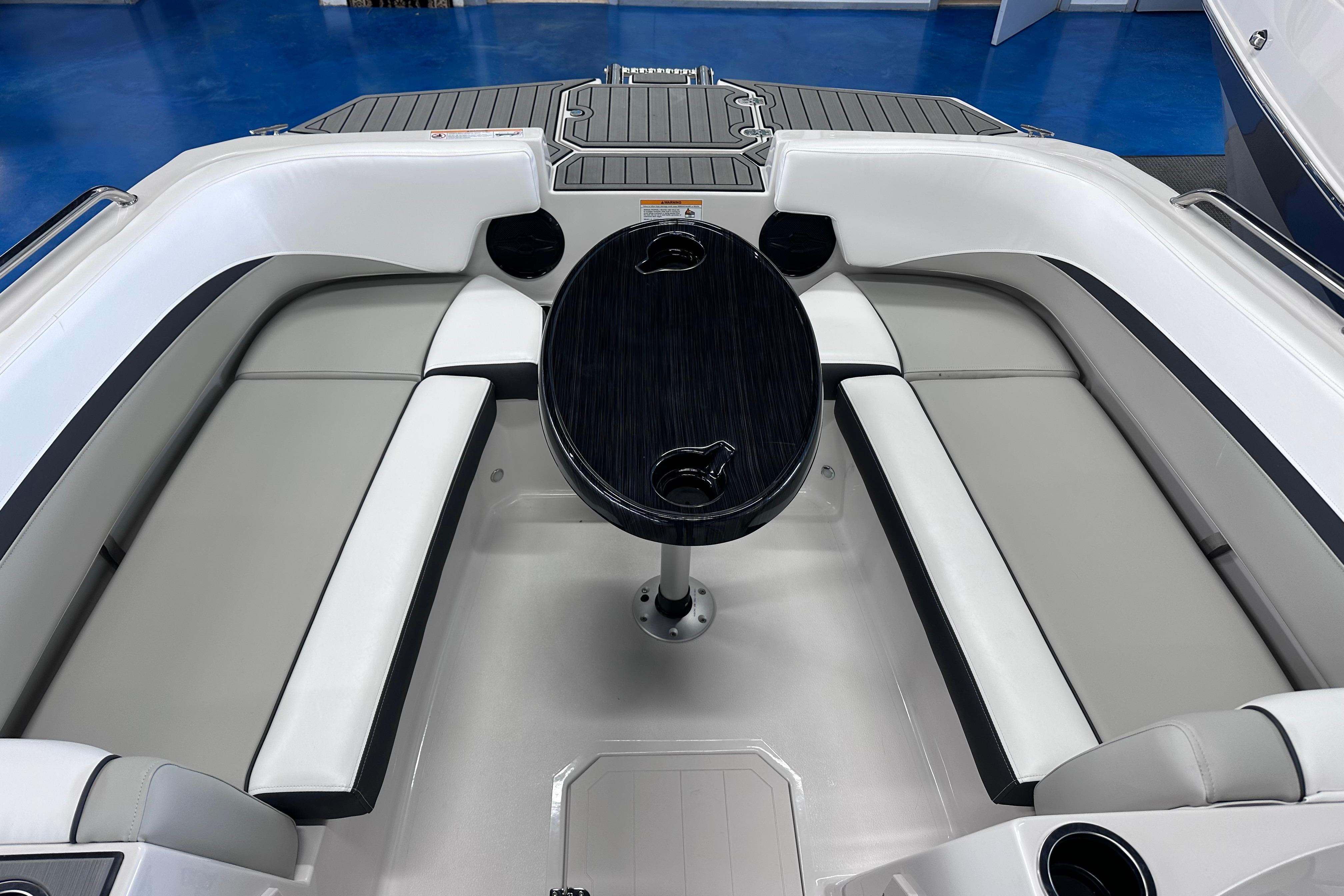 2026 Starcraft SVX 191 OB boat interior with sleek seating and central table.