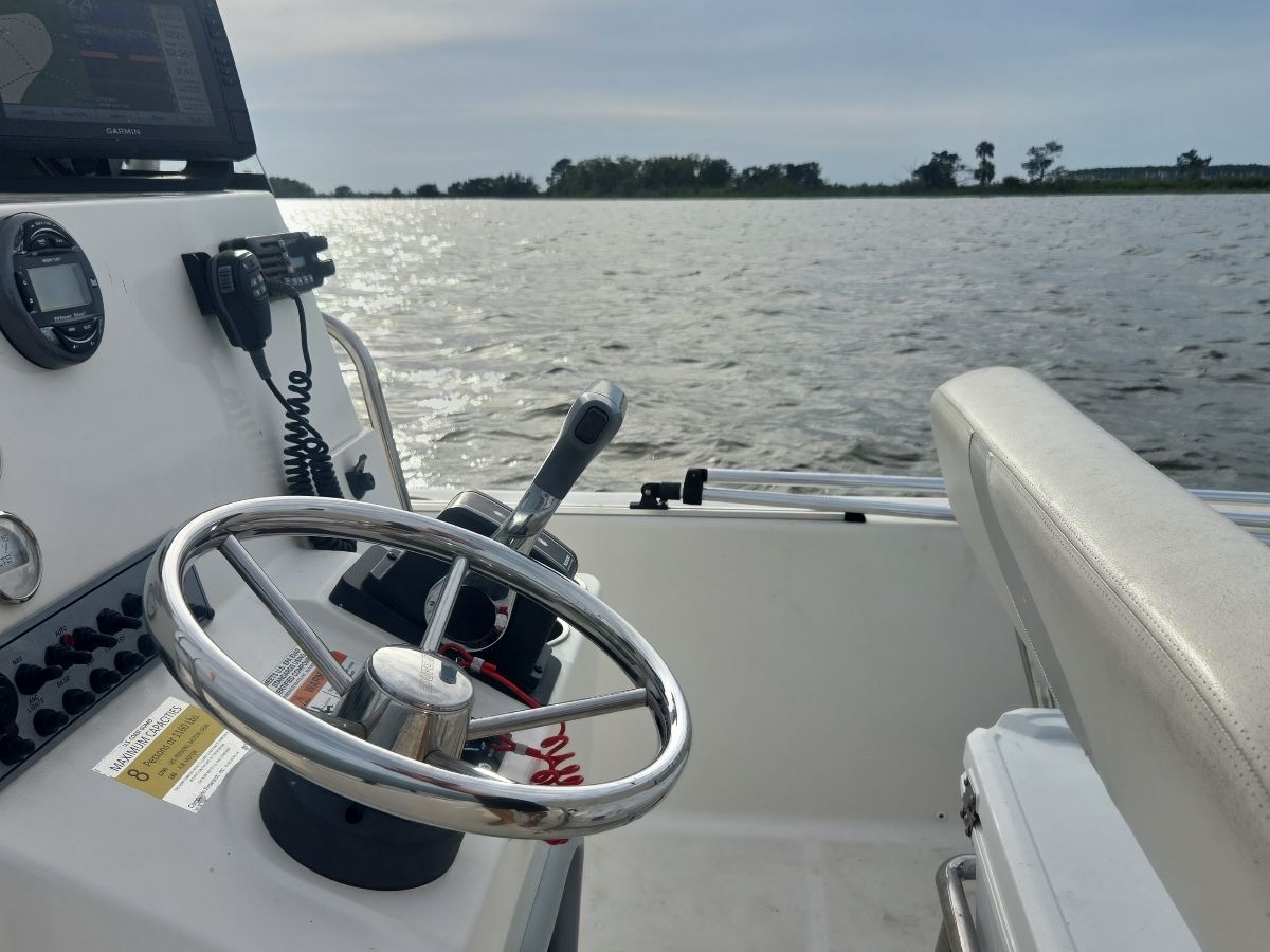 Cockpit of a 2014 Sundance DX20 boat on the water.
