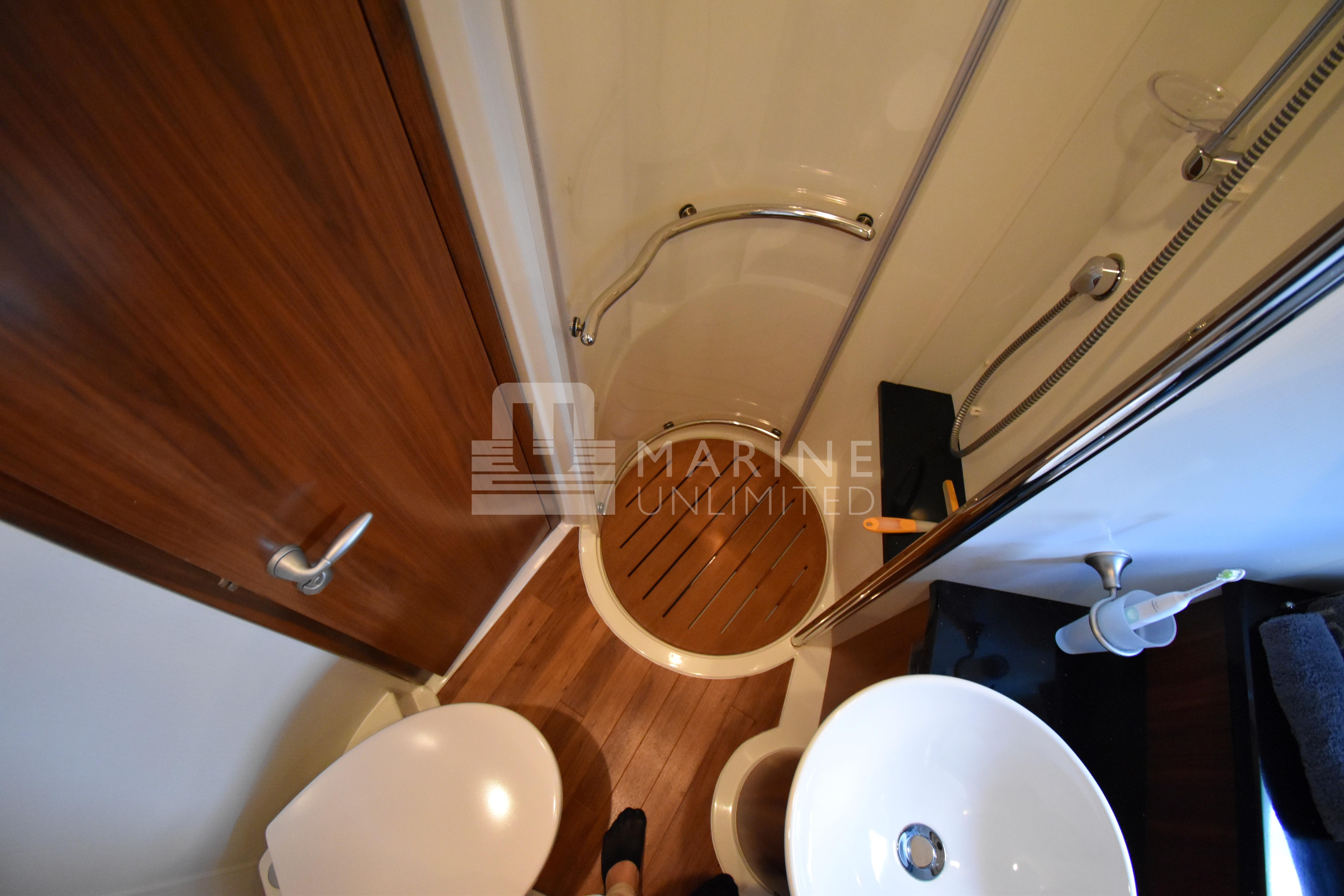 Luxurious bathroom in 2010 Sunseeker Manhattan 52 yacht with modern fixtures.