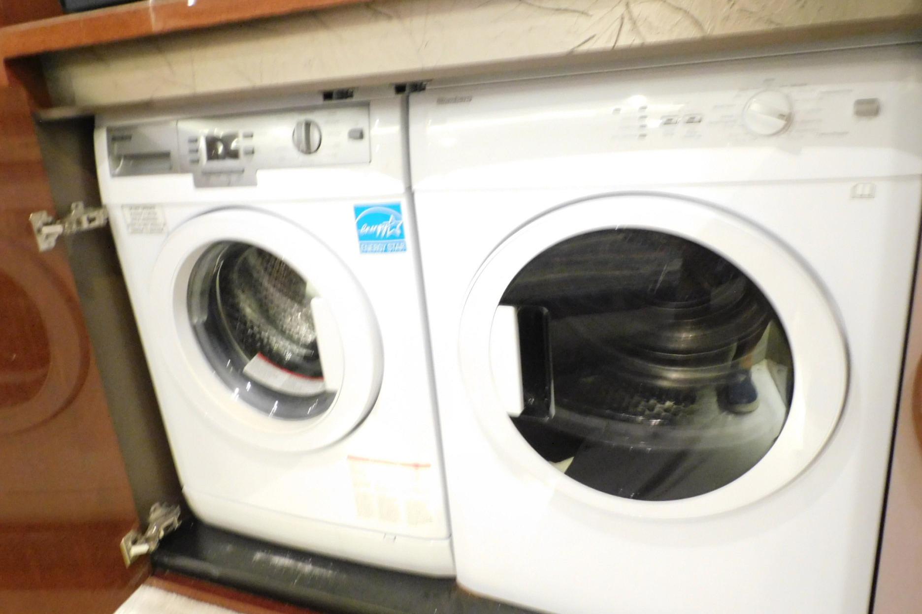 Laundry appliances inside a 2019 Sea Ray L550 yacht cabinet.