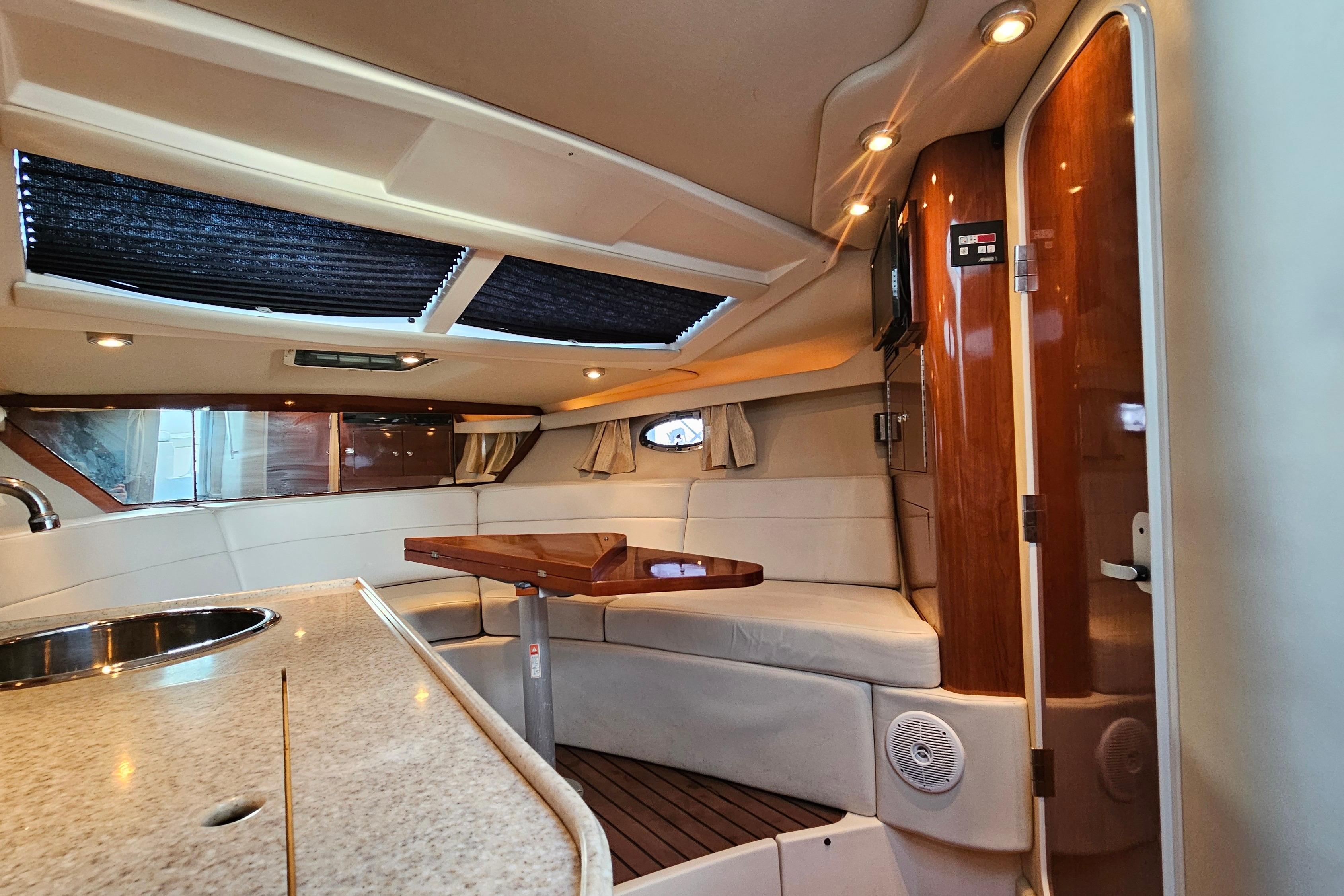Interior of 2005 Regal 3060 Window Express yacht with elegant seating and modern amenities.