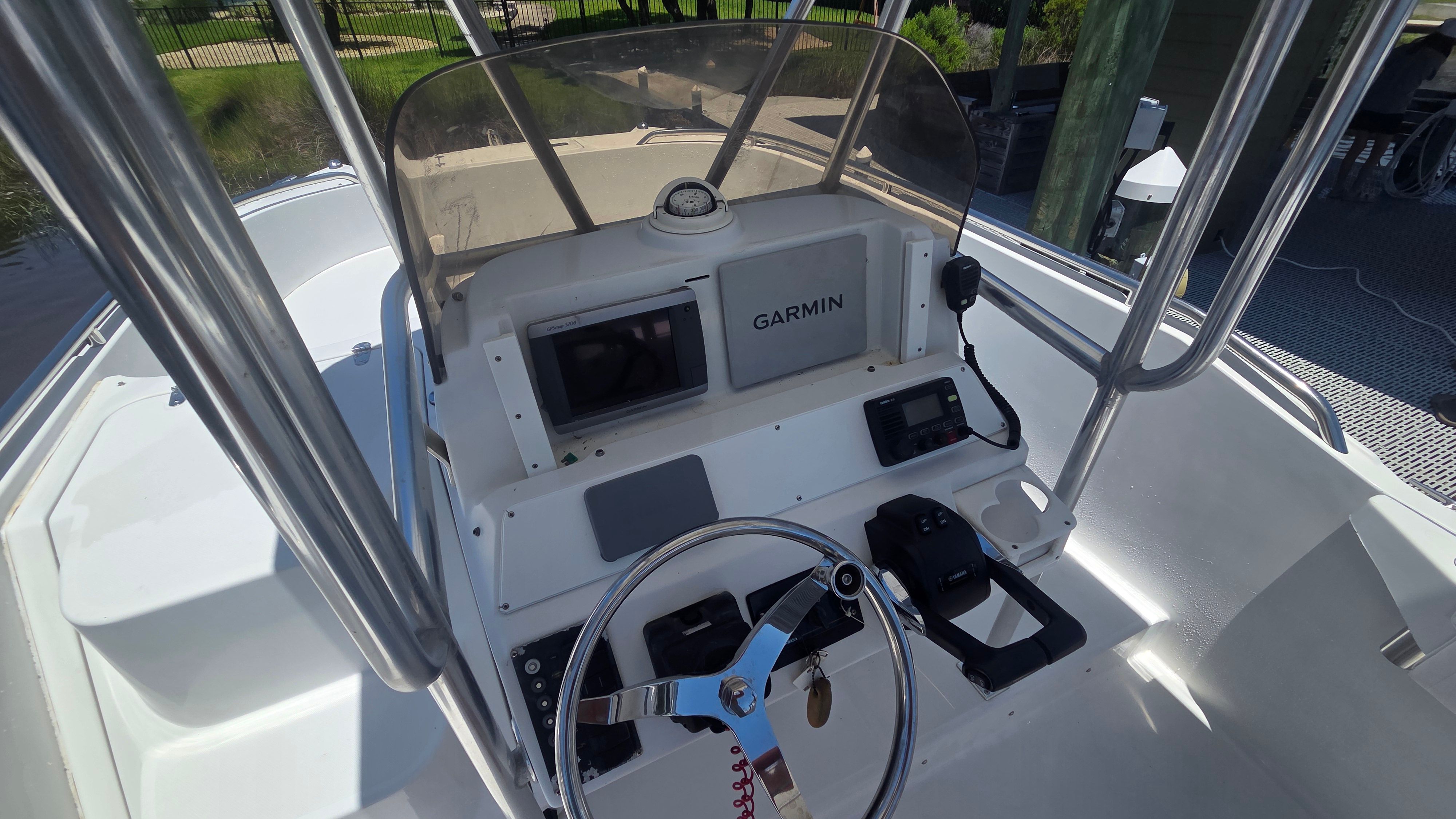The image shows the helm of a 2001 Glacier Bay Canyon Runner 2260 boat.