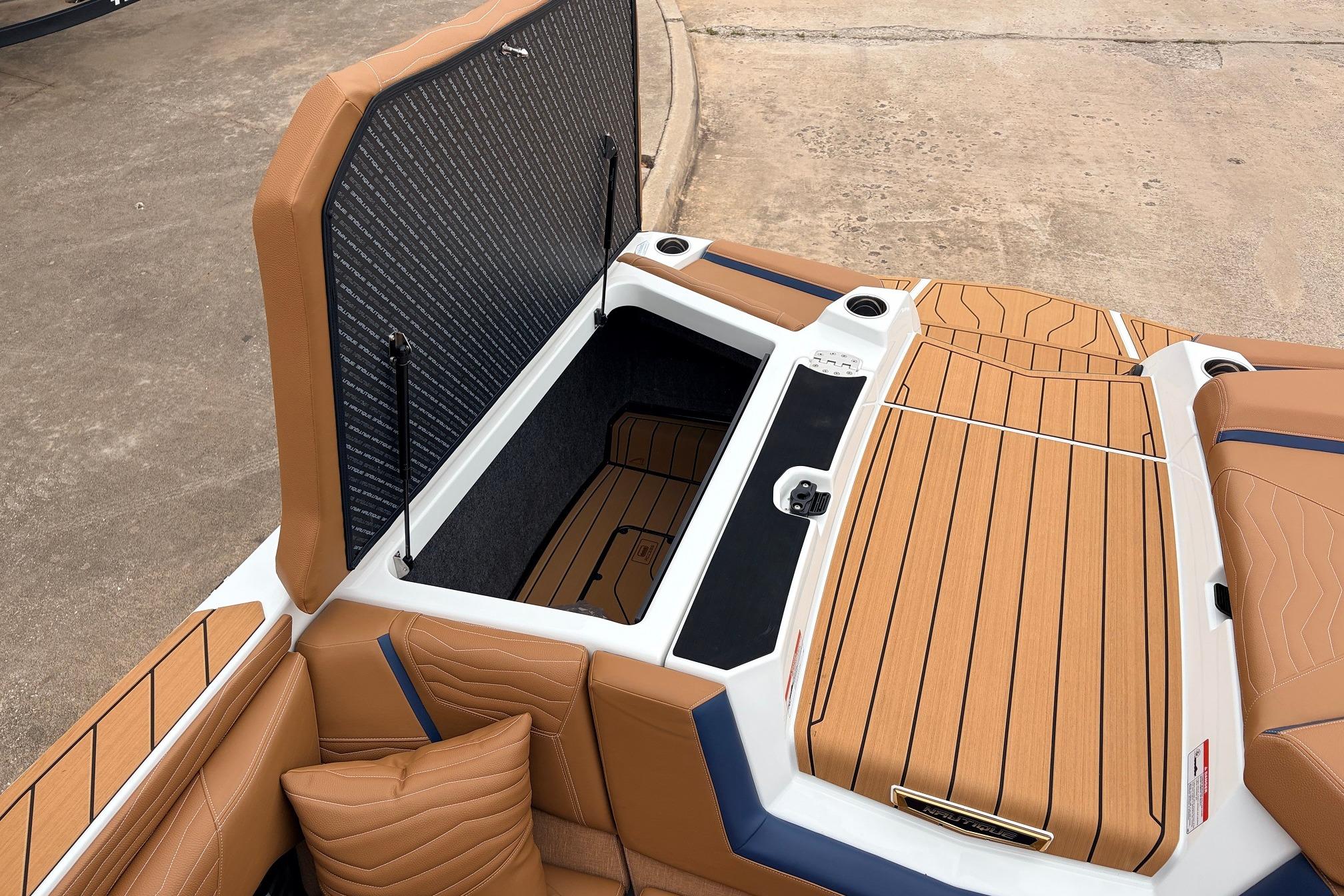 2026 Nautique Super Air Nautique G25 boat interior with open storage compartment.