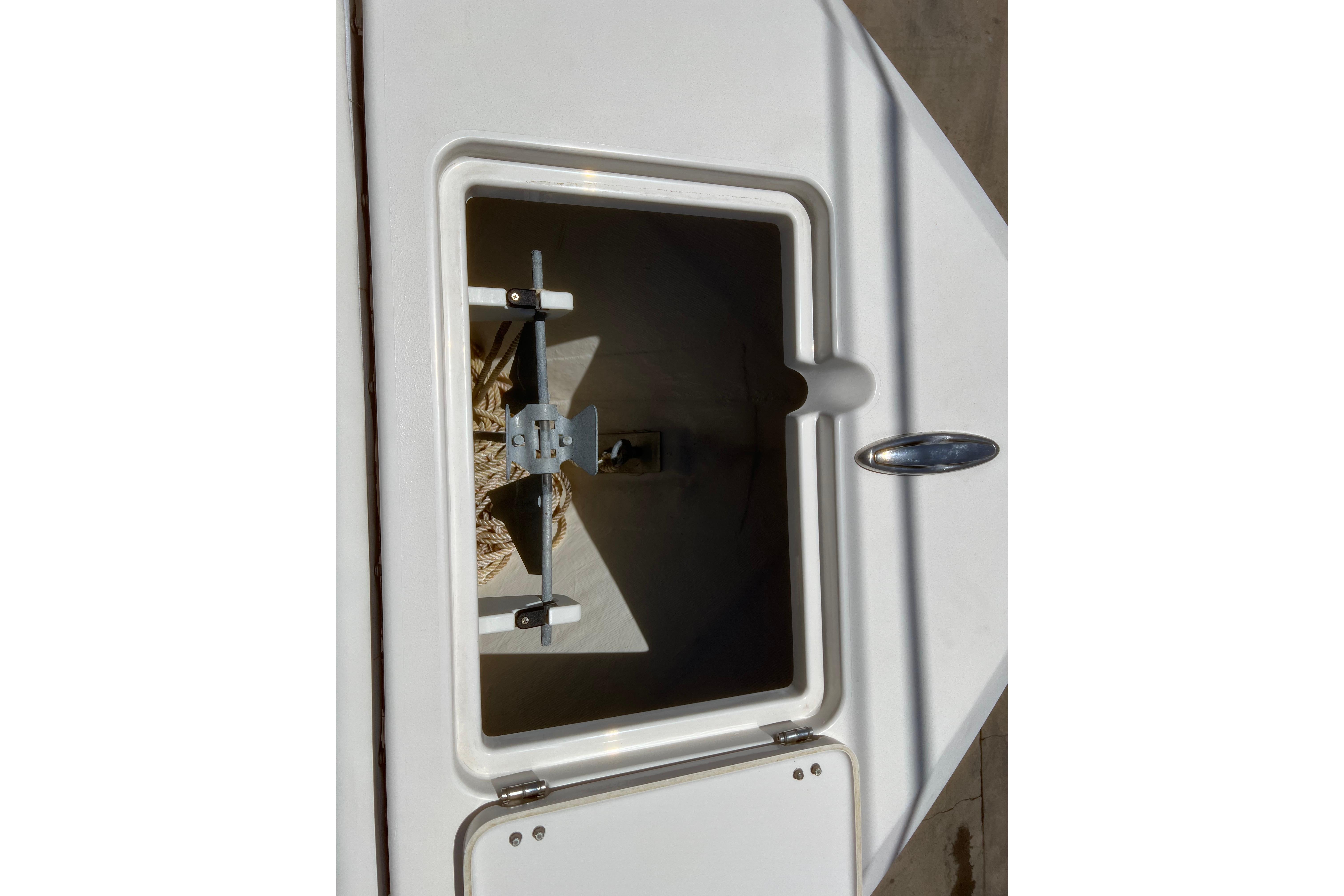 Anchor storage compartment on 2018 Cobia 201 Center Console boat.