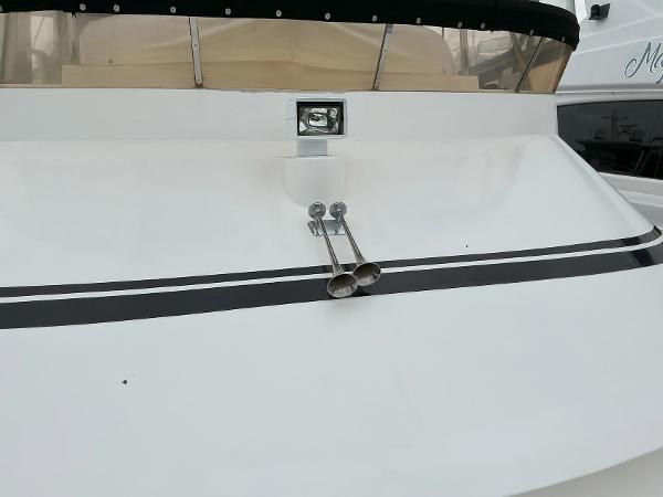 Novatec Islander 55 yacht, 2000 model, featuring sleek white deck and dual horns.