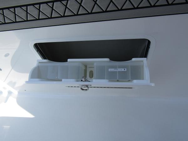 Storage compartment on the 2024 Wellcraft 352 Fisherman boat.