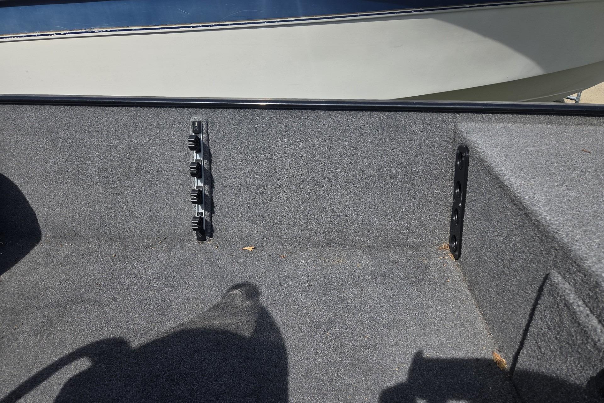 Interior view of 2024 TRACKER MARINE CLASSIC XL boat with carpeted flooring.