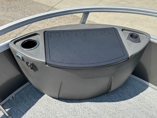 2026 Sun Tracker Bass Buggy 18 DLX boat console with cup holders and storage.
