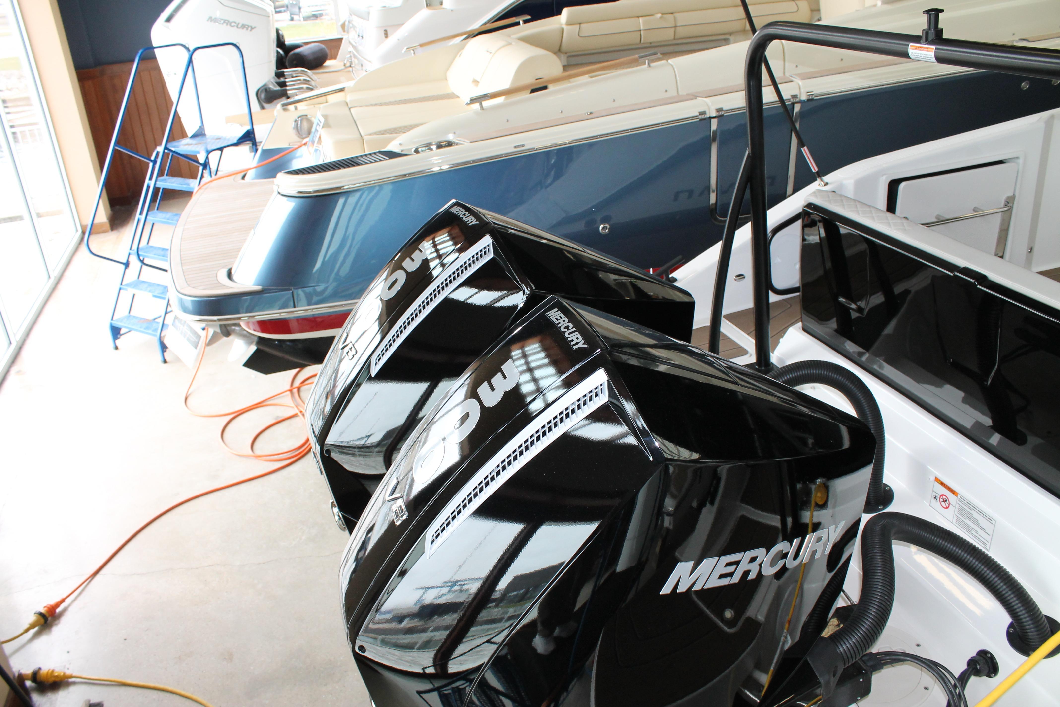 Twin Mercury outboard engines on a Navan C30 boat, 2026 model, in a showroom.