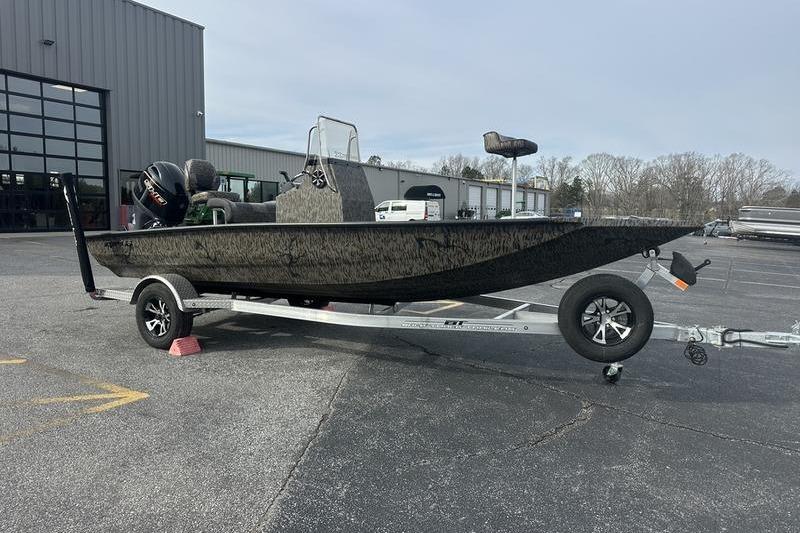 2026 Xpress H190B Bay boat on trailer in parking lot.