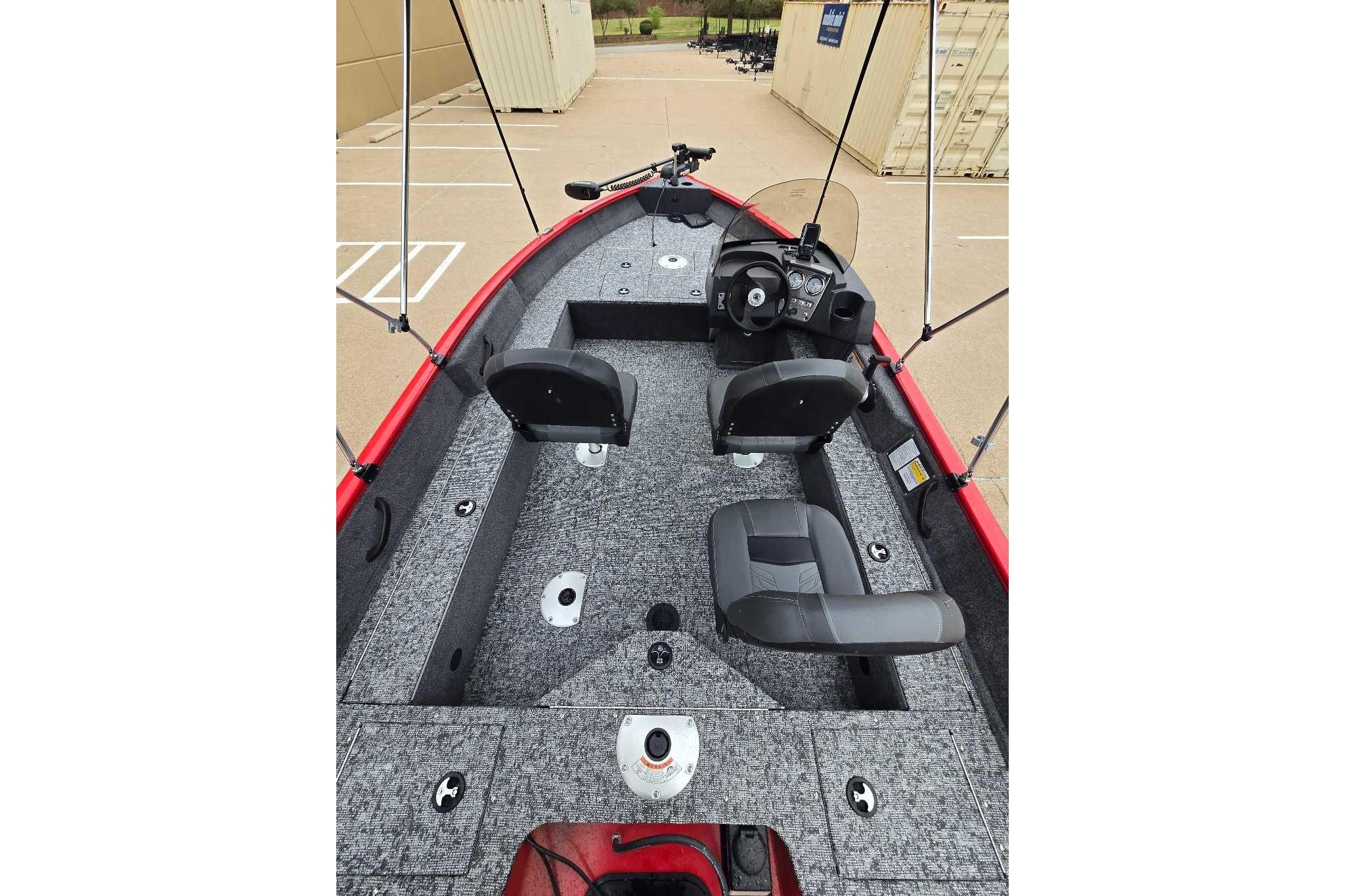 2026 Tracker Pro Guide V-16 SC boat interior with seating and steering console.
