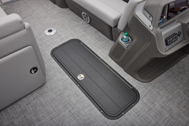2026 Sun Tracker Party Barge 22 DLX interior with gray flooring and seating.