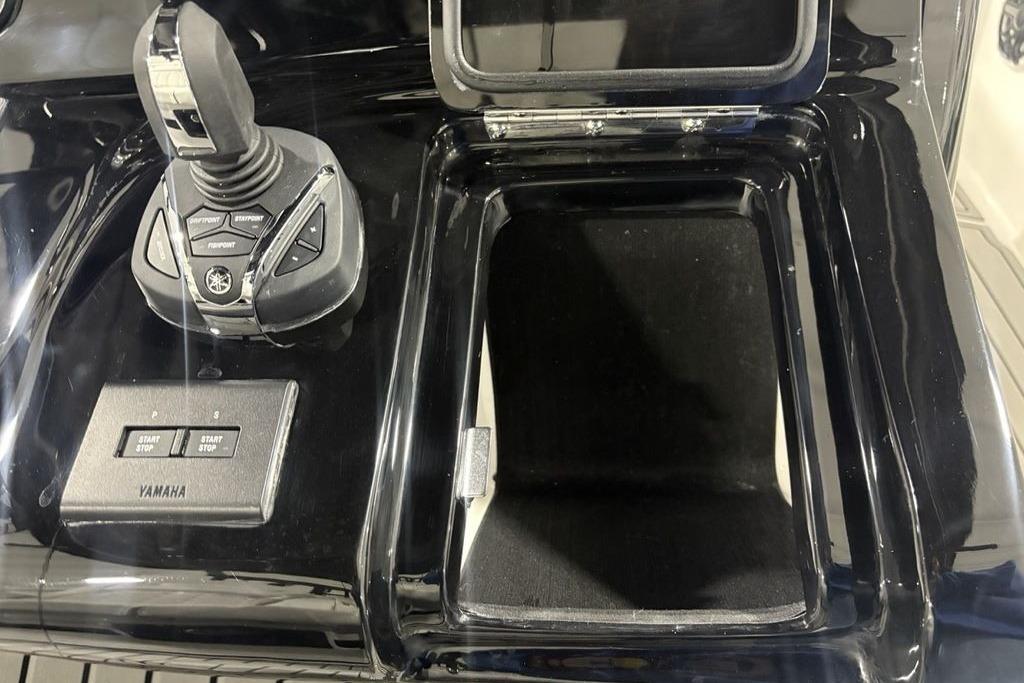 Control panel of 2026 Tidewater 3100 Carolina Bay boat with Yamaha joystick and buttons.