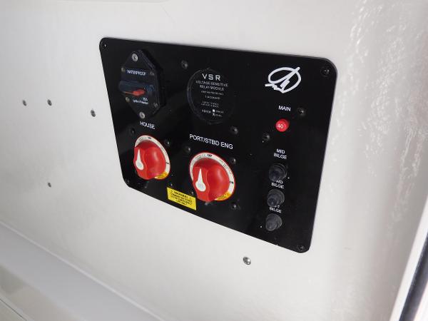 Control panel of a 2024 Sailfish 242 CC boat with battery switches.