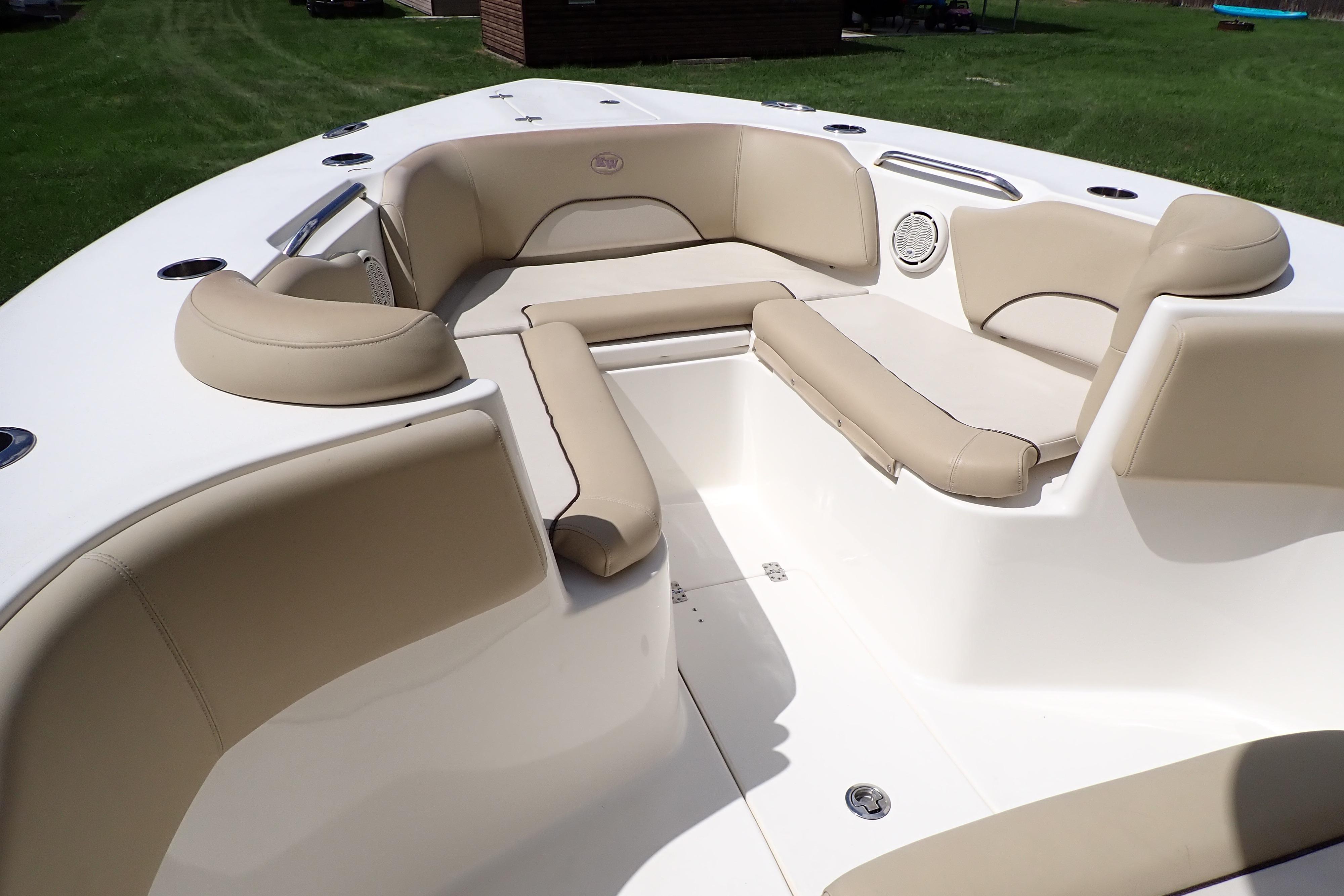 2019 Key West 263 FS boat interior with beige seating and cup holders.