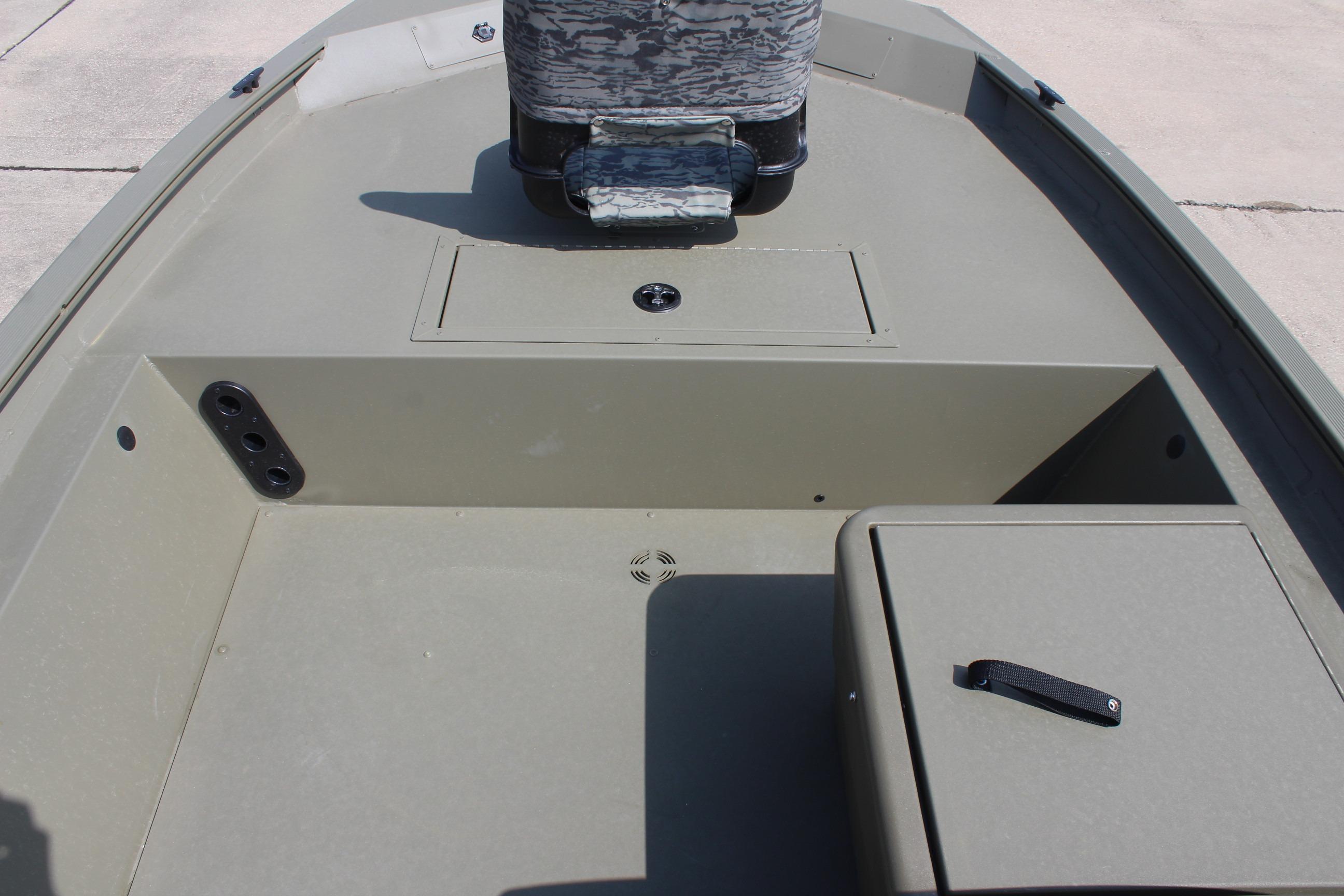 2026 Tracker Grizzly 1754 SC boat interior with storage compartments and seating.