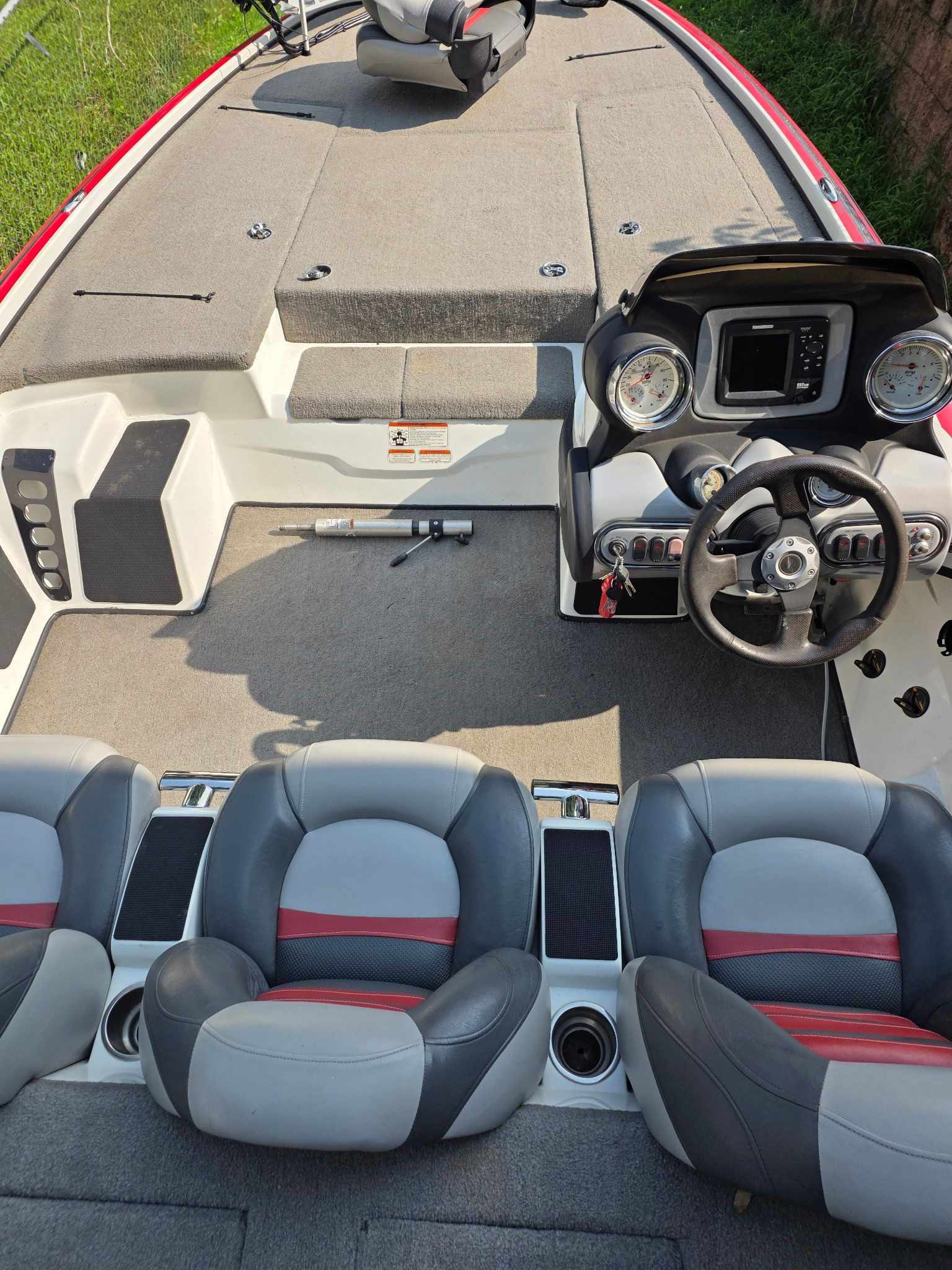 Interior view of a 2010 Nitro Z-8 boat with gray and red seating.