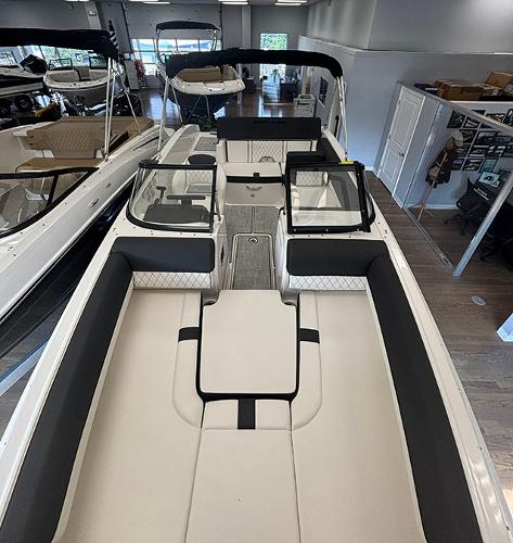 2024 Bayliner DX 2050 boat interior, spacious seating, modern design, showroom display.