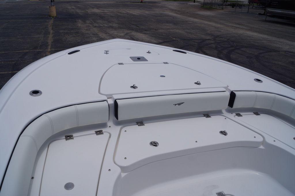 2027 Tidewater 2500 Carolina Bay boat deck with seating and storage compartments.