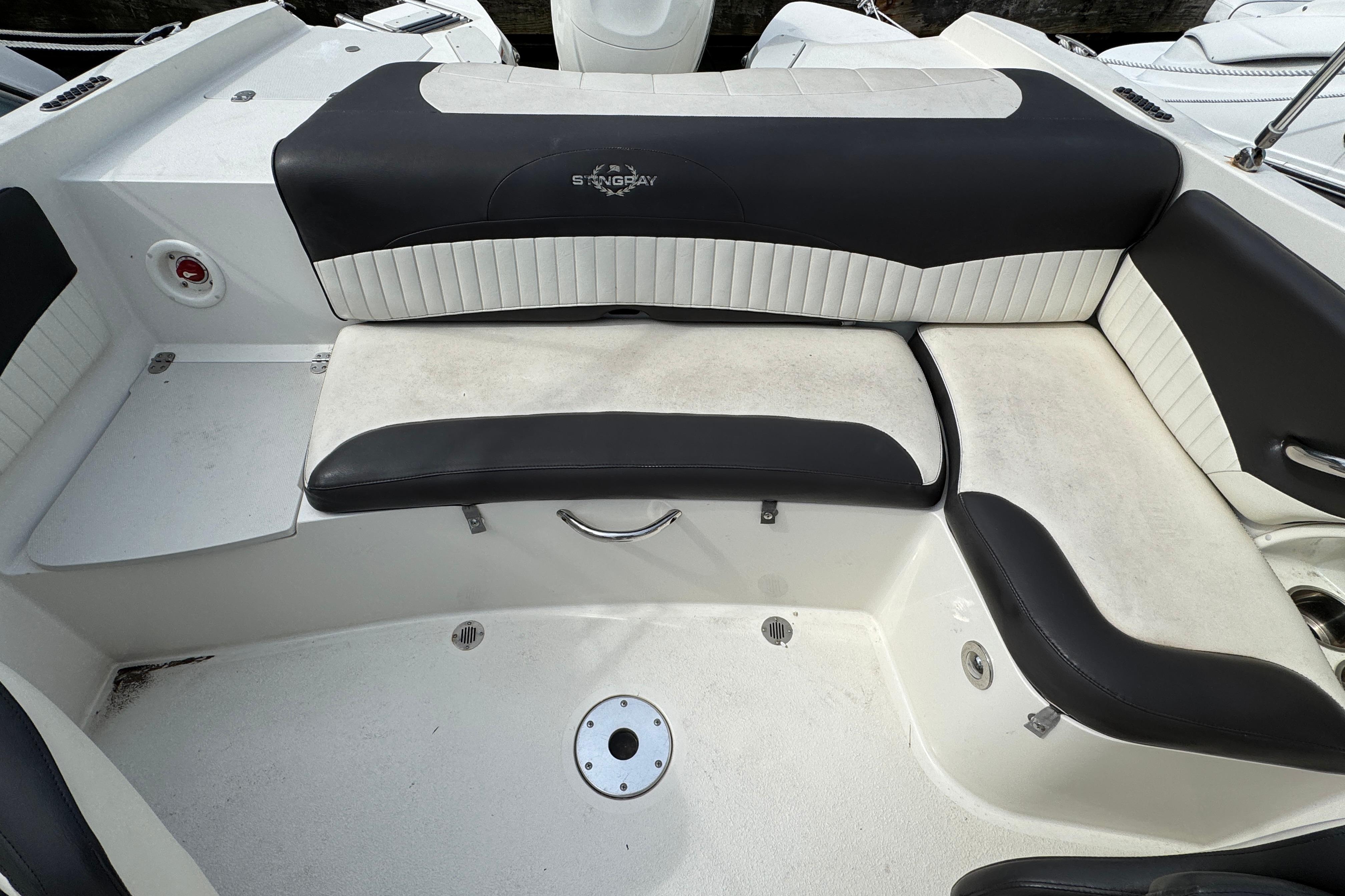 2018 Stingray 204 LR boat interior with black and white seating arrangement.