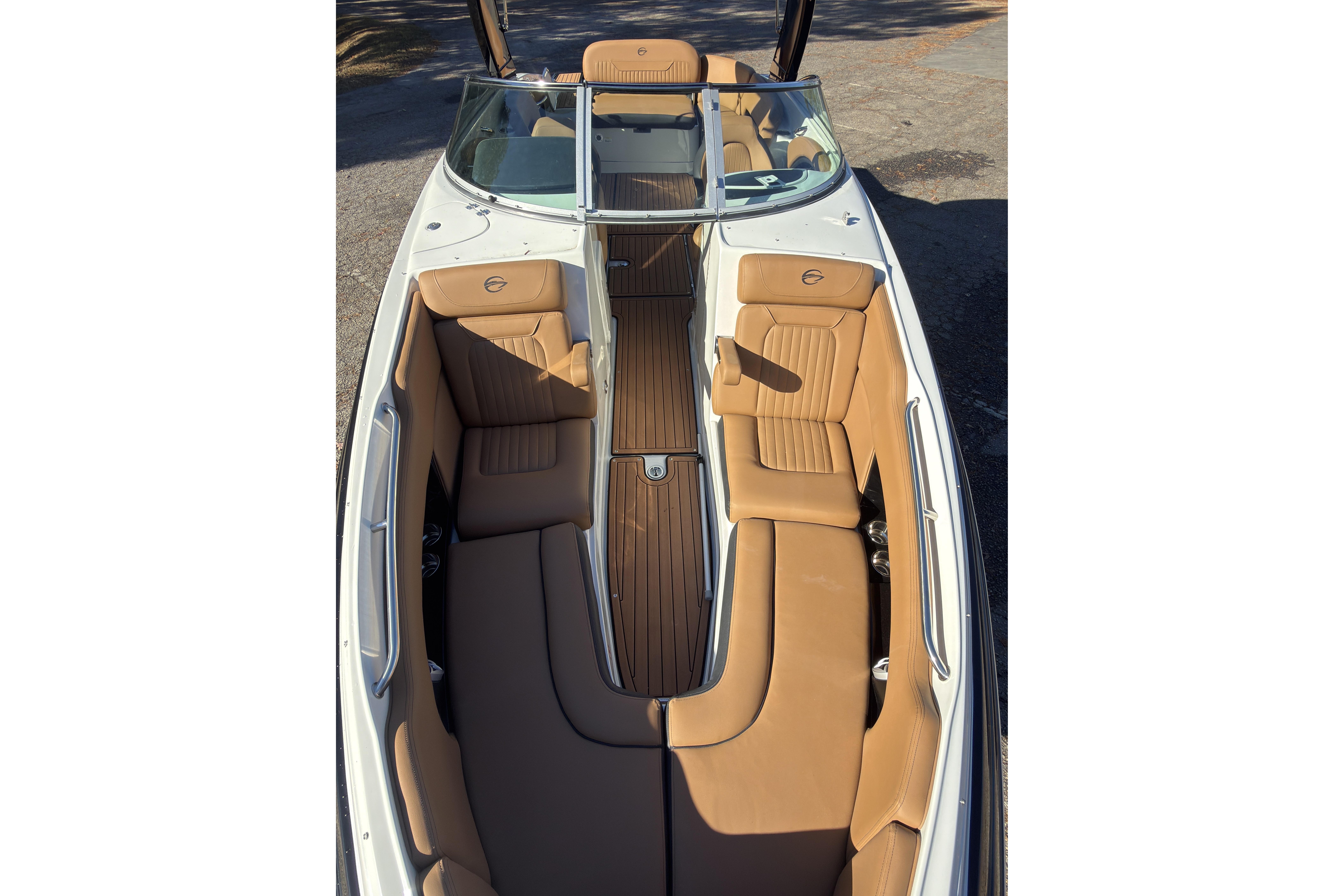 2026 Crownline 298 SS boat interior with tan leather seating and sleek design.