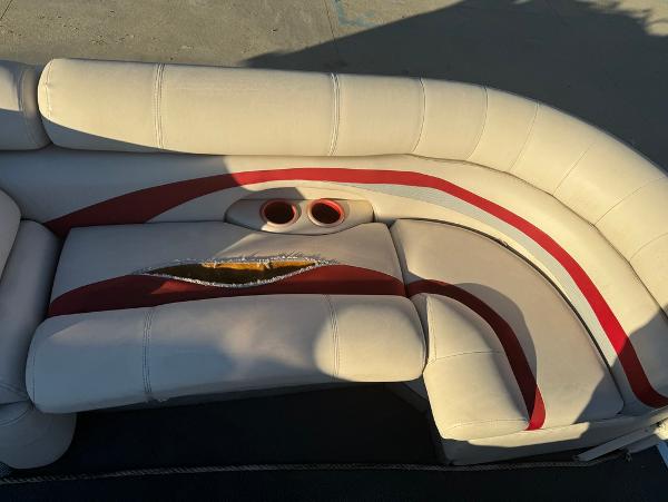 Torn upholstery on 2005 Starcraft 22 Sport boat seat with cup holders.