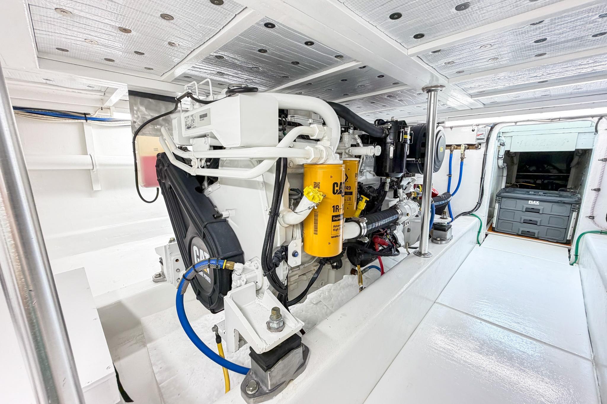 Engine room of 1998 Blackwell Custom Carolina Sportfish, showcasing clean and organized machinery.