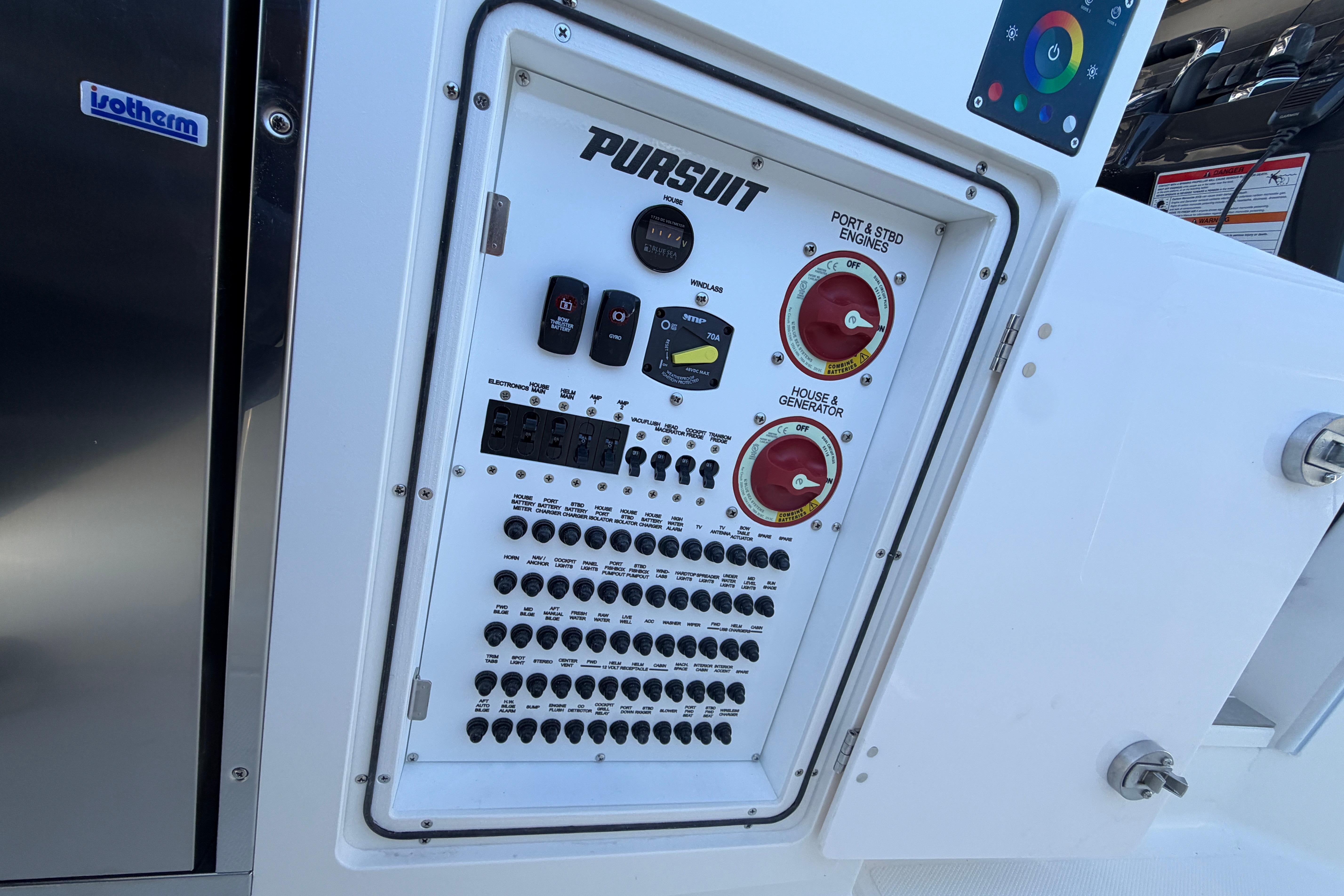 Control panel of 2026 Pursuit S 358 Sport boat with various switches and dials.