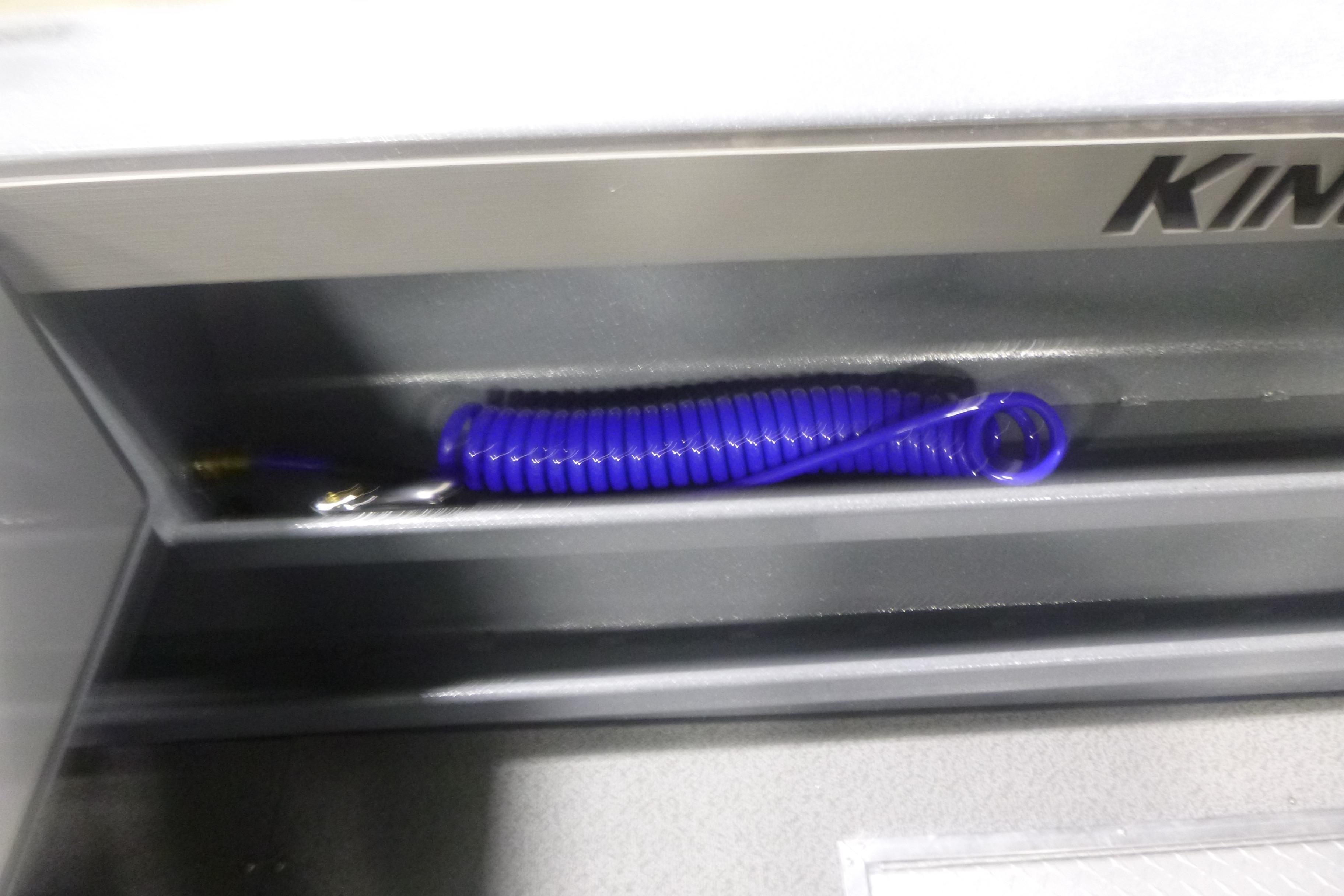 Coiled blue hose in KingFisher 2425 Escape HT boat compartment, 2026 model.