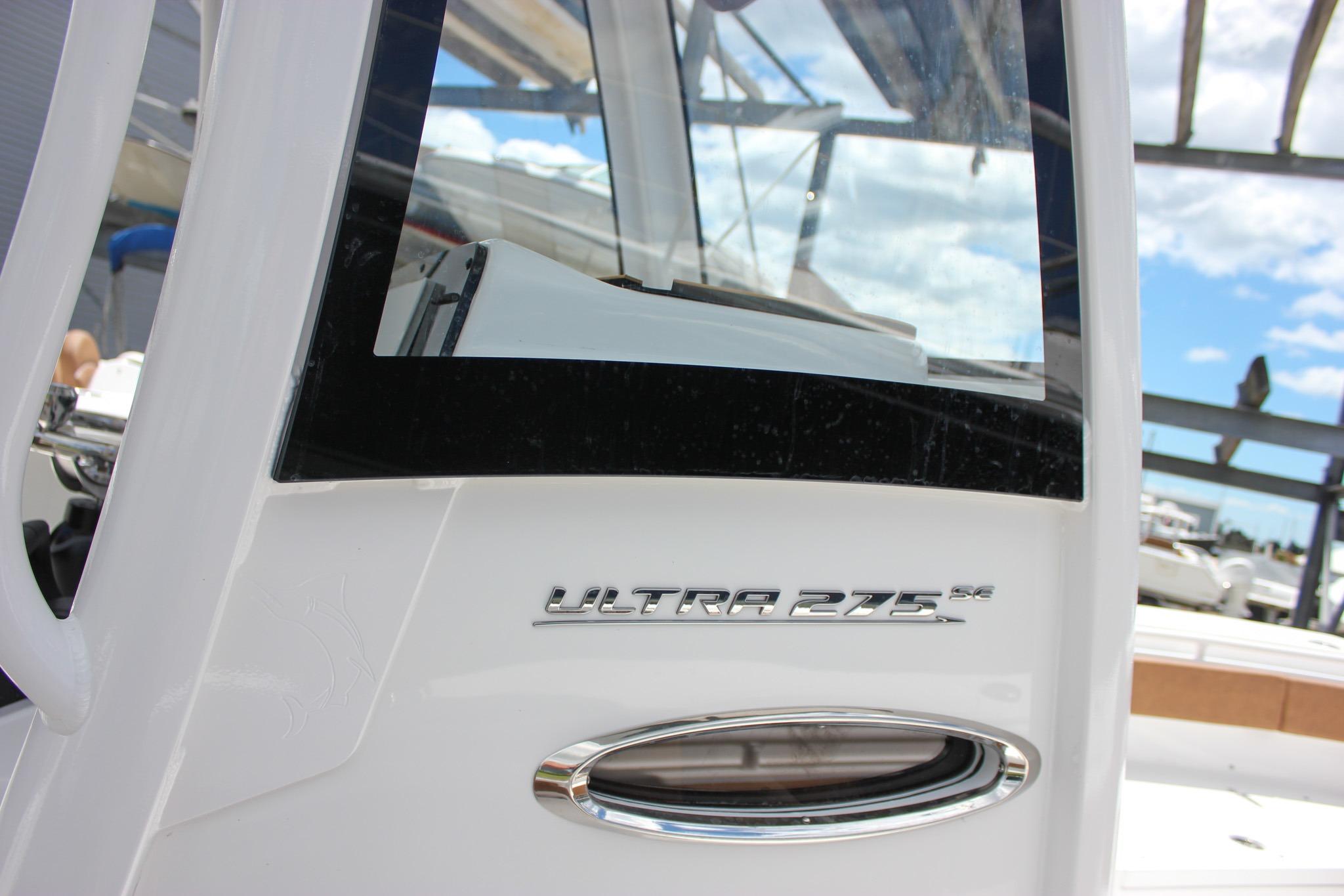 2027 Sea Hunt Ultra 275 SE boat detail with logo and window.