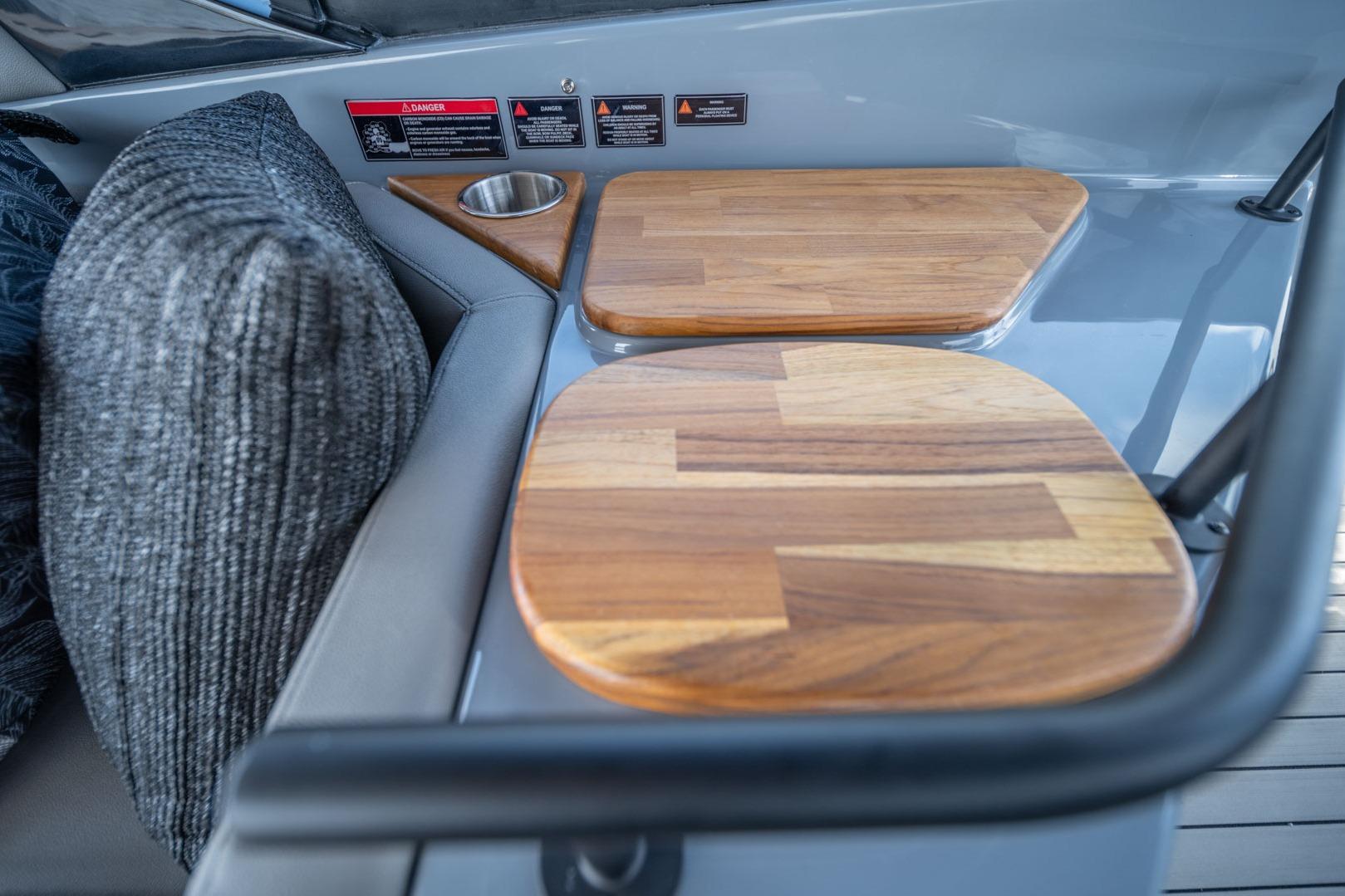 Interior of 2026 Hanover 387 boat with wooden accents and cushioned seating.