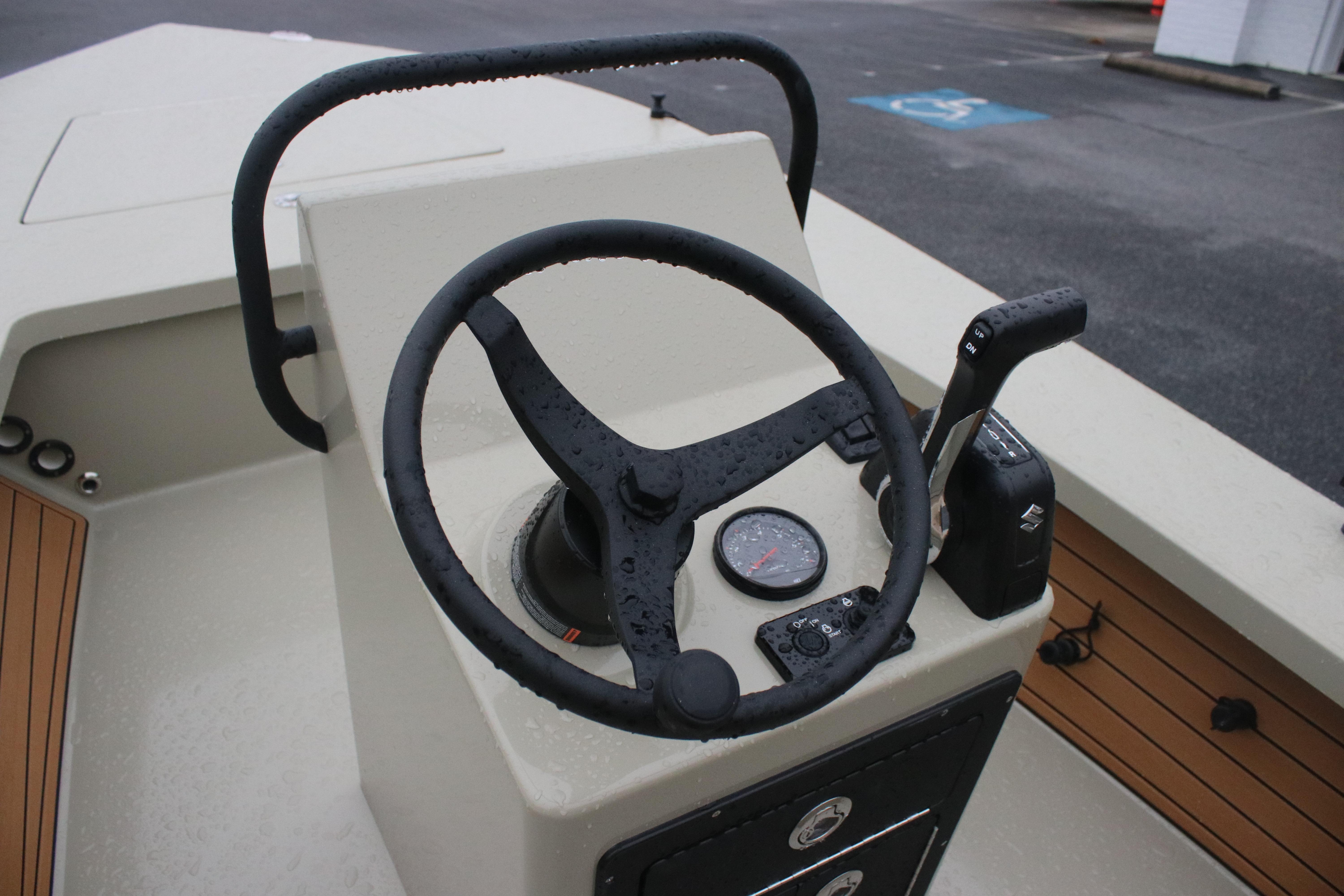 Steering console of 2026 East Cape EVO 18V boat with wet controls and gauge.
