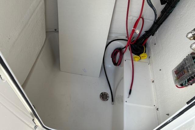 Interior of Key West 189 FS boat, wiring visible.