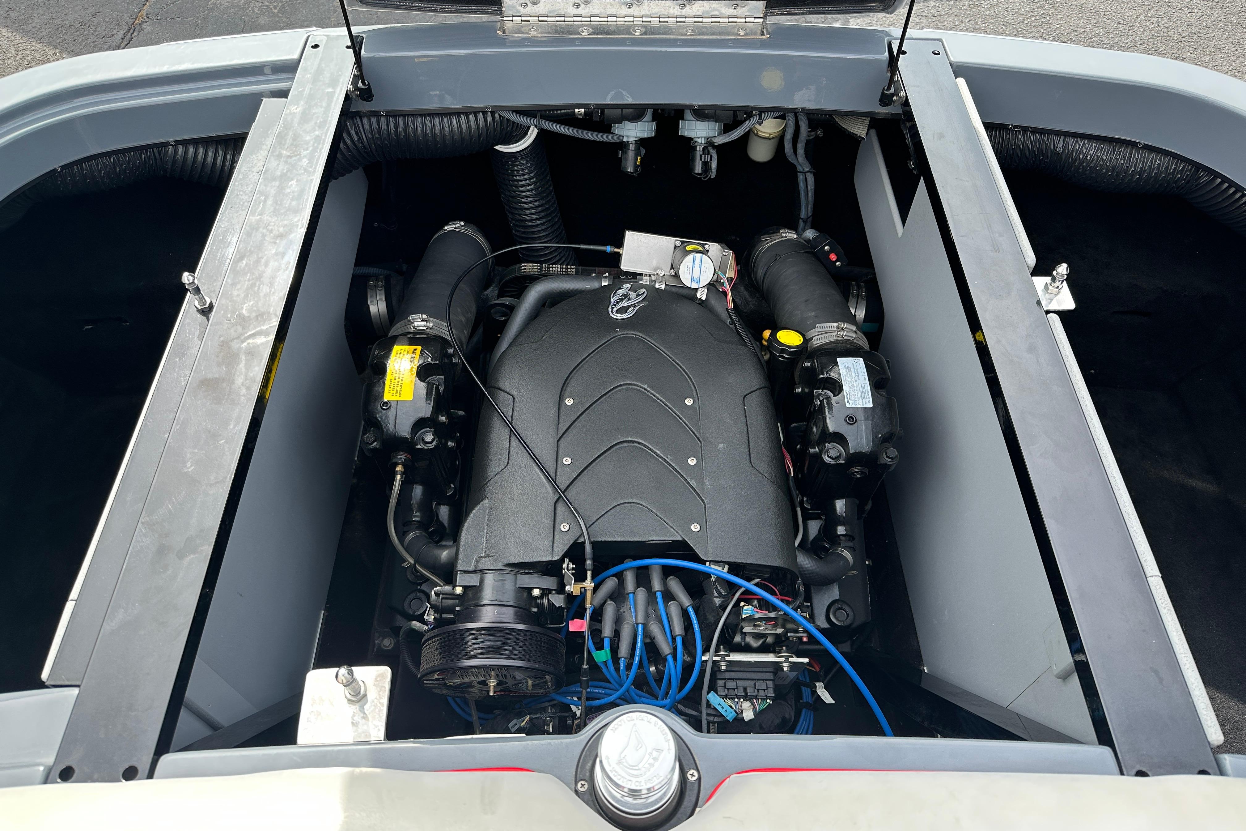 Engine compartment of a 2008 Centurion Enzo SV240 boat, showcasing detailed components.