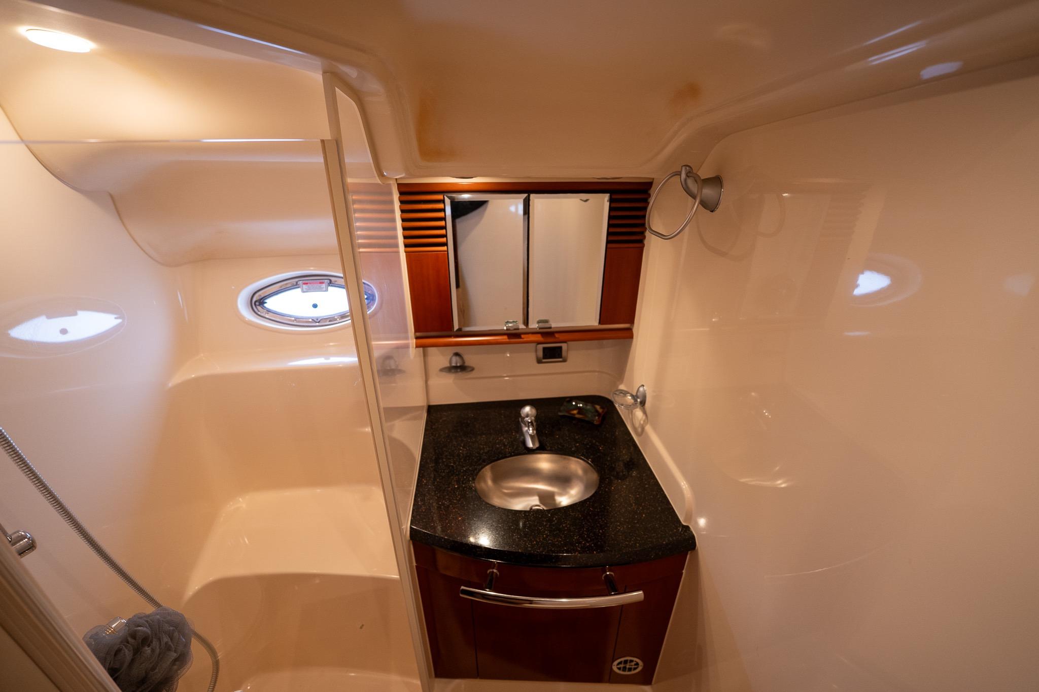 Luxurious bathroom interior of 2005 Sea Ray 500 Sundancer yacht with sleek design.