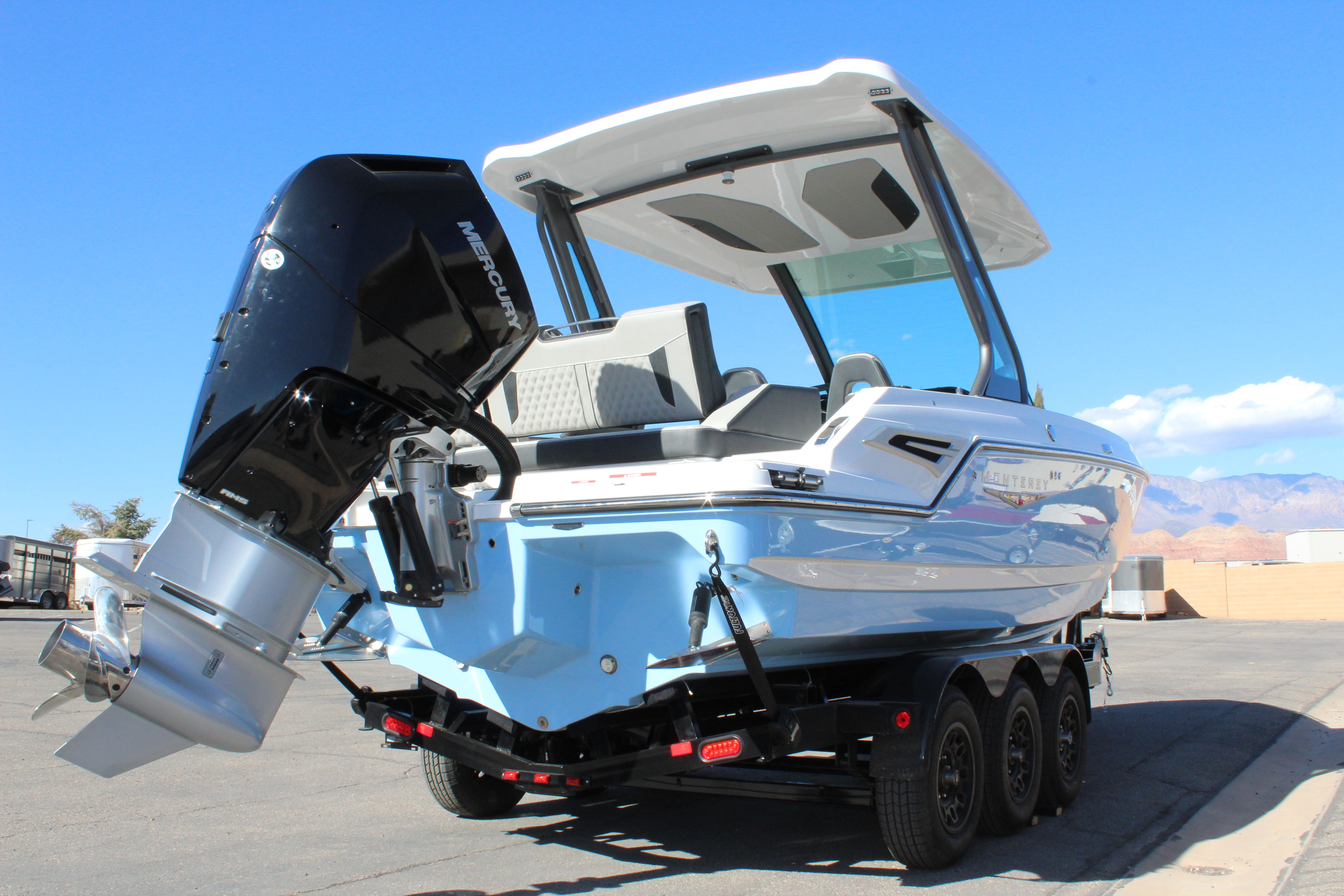 2025 Monterey Elite 27 OB boat with outboard motor.